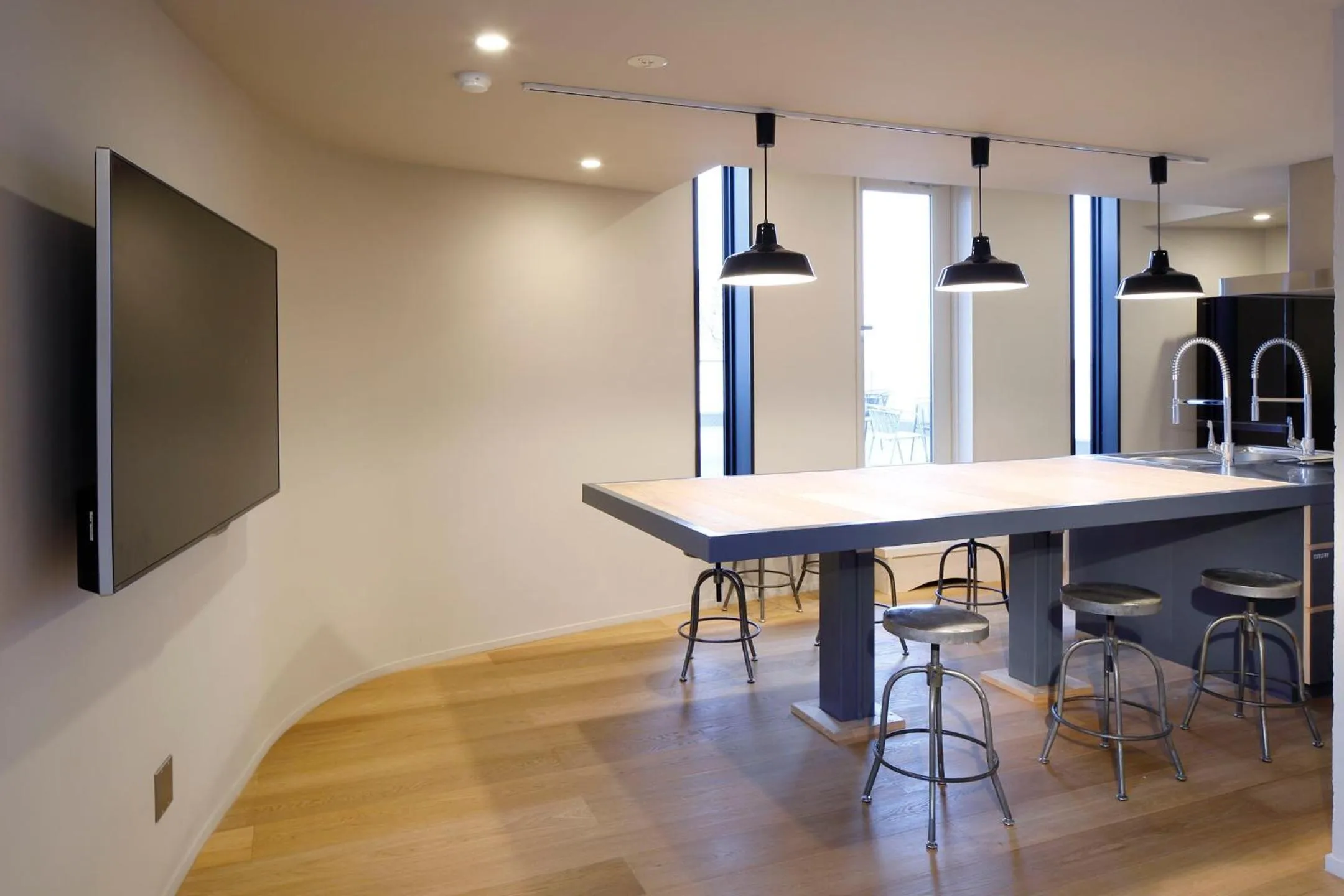 Communal kitchen in HakoBA Hakodate by THE SHARE HOTELS