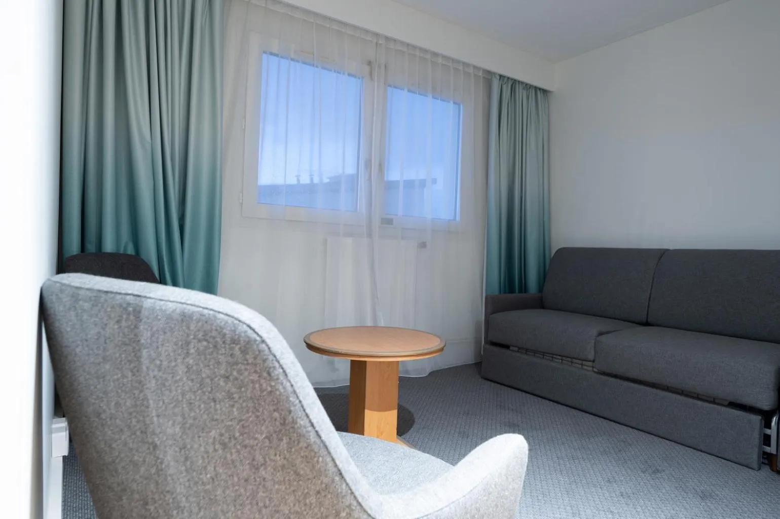 Seating area in Holiday Inn Calais-Centre by IHG