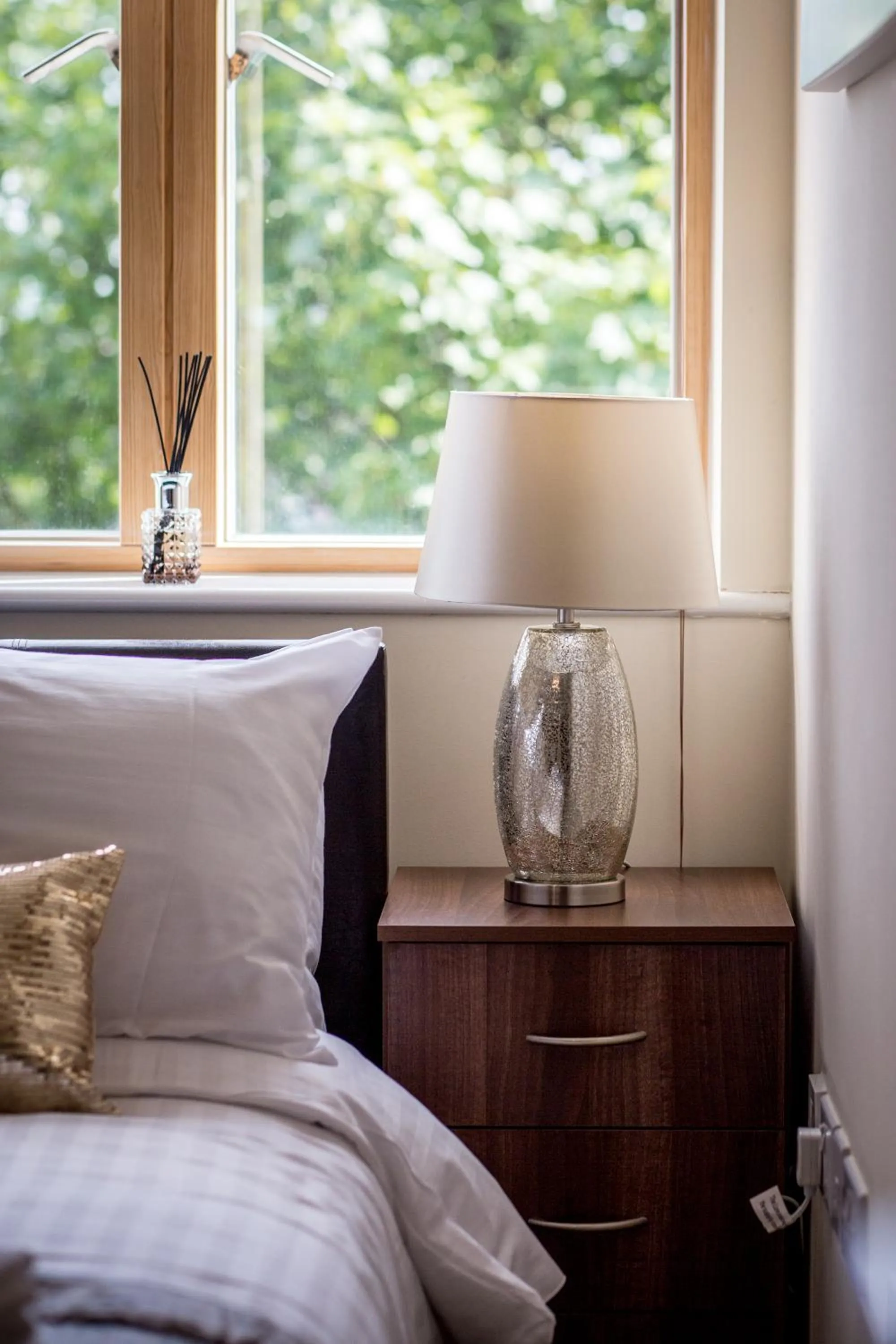 Decorative detail, Bed in Mica Point City Centre Apartment
