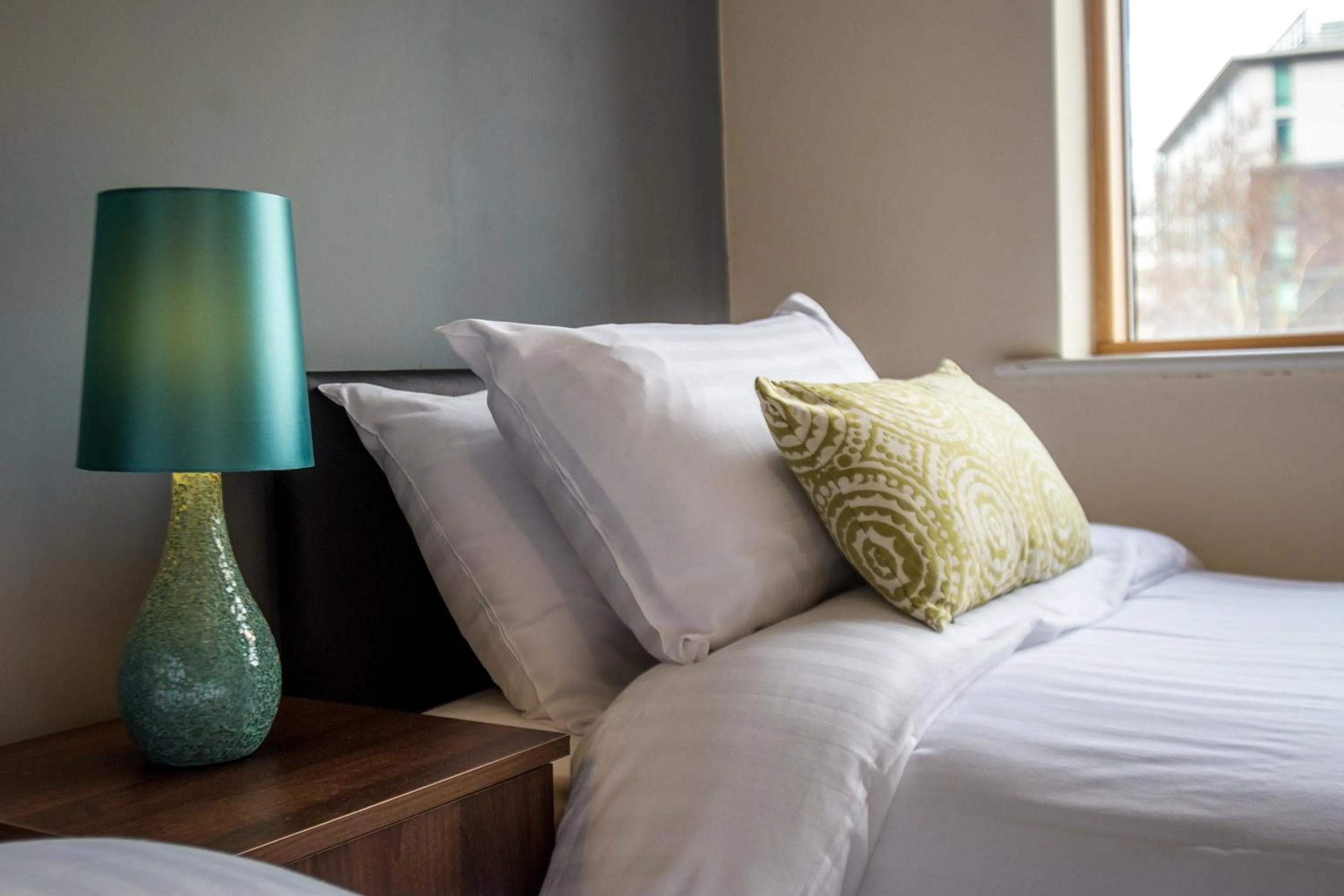 Decorative detail, Bed in Mica Point City Centre Apartment