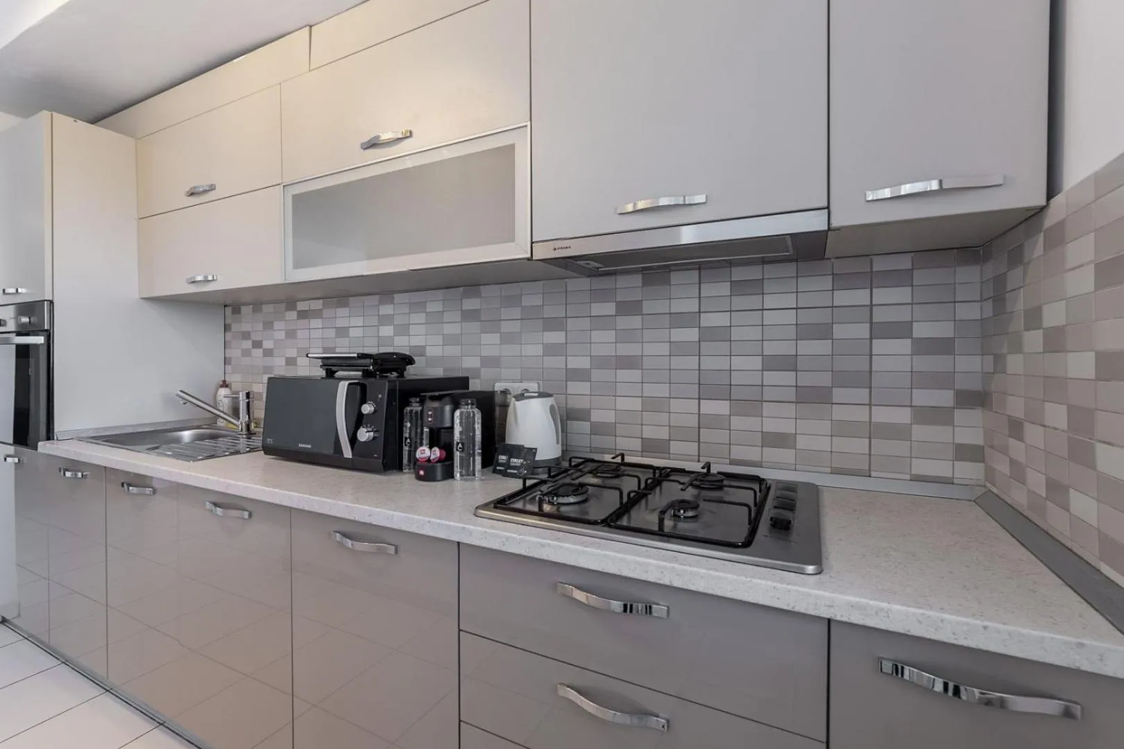 Kitchen or kitchenette in Monaco Grand Apartments By CityBookings