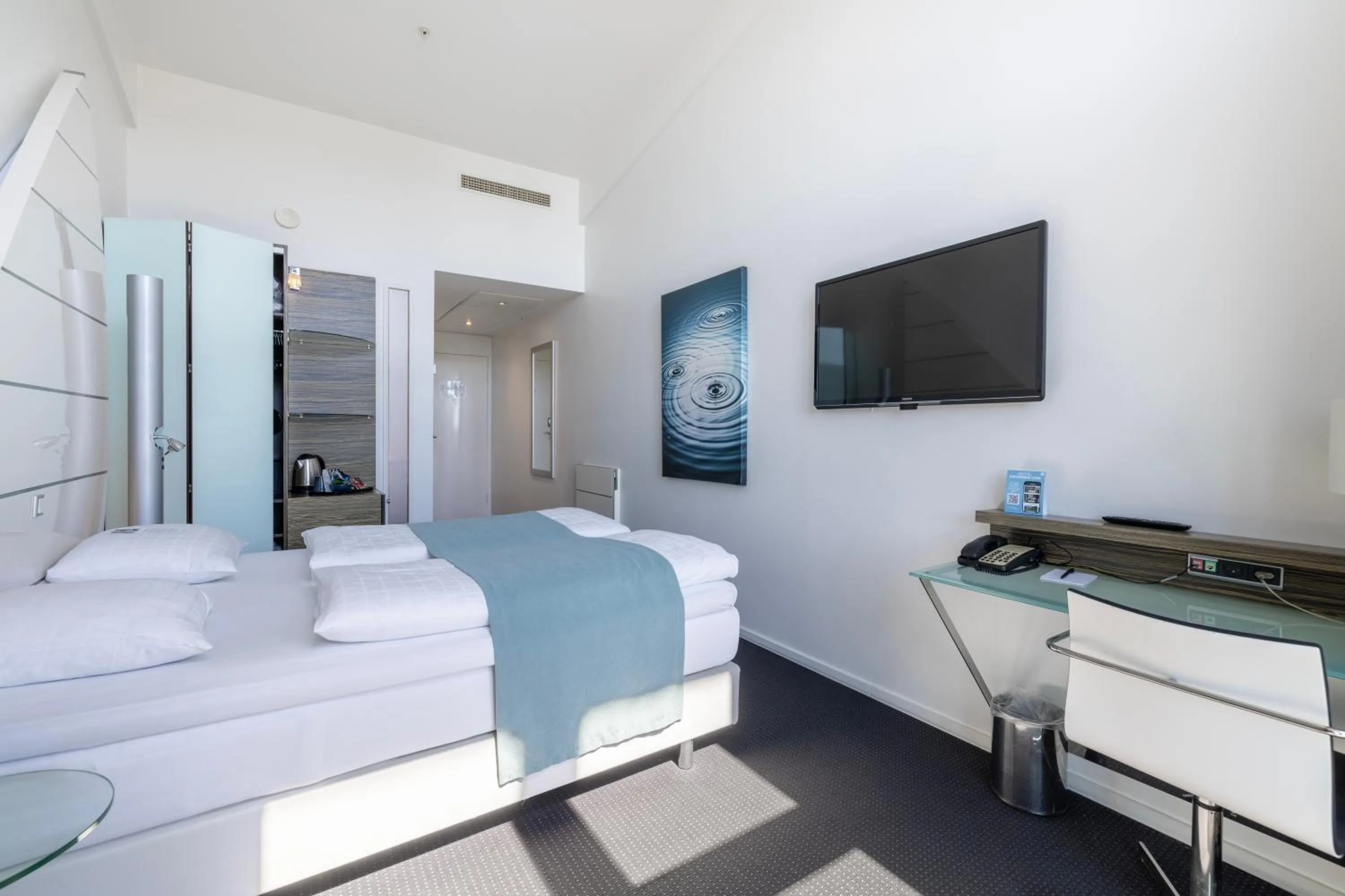 Bed in Copenhagen Island Hotel