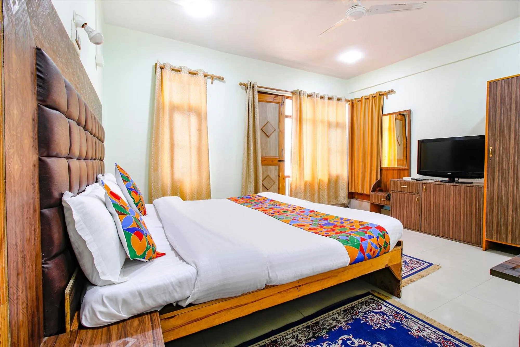 Bed in FabHotel Grand Comforts