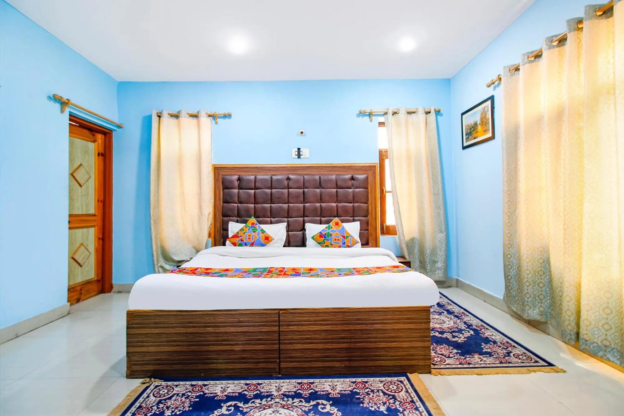 Bed in FabHotel Grand Comforts