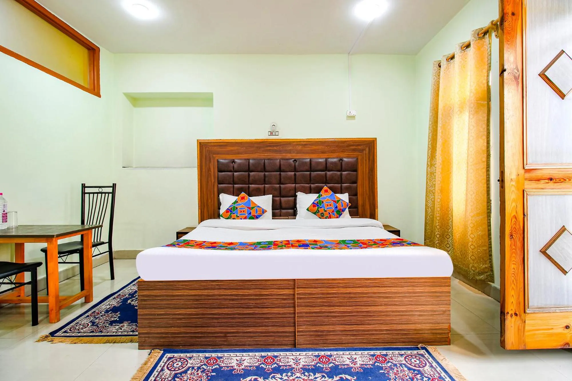 Bed in FabHotel Grand Comforts