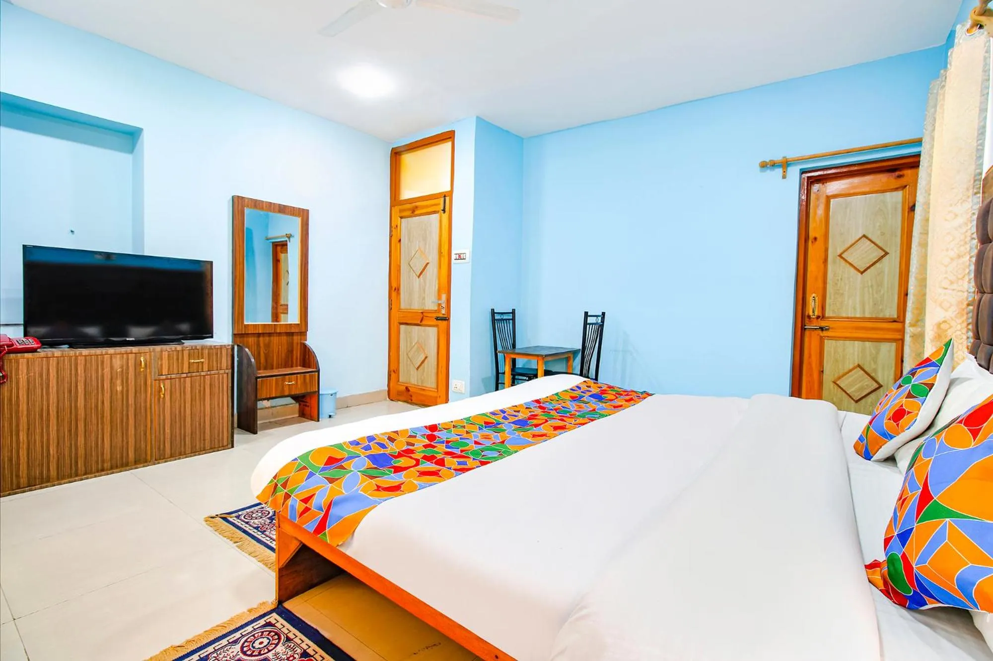 Bed in FabHotel Grand Comforts