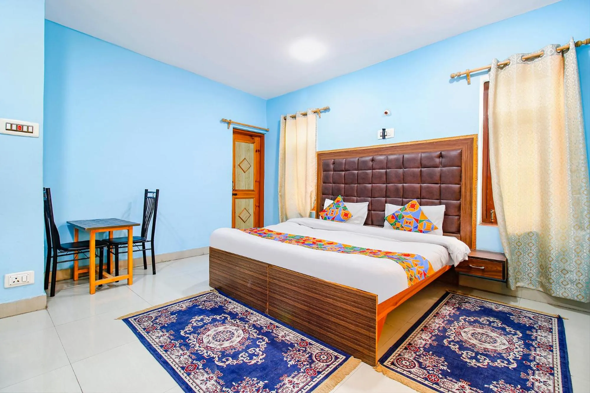 Bed in FabHotel Grand Comforts