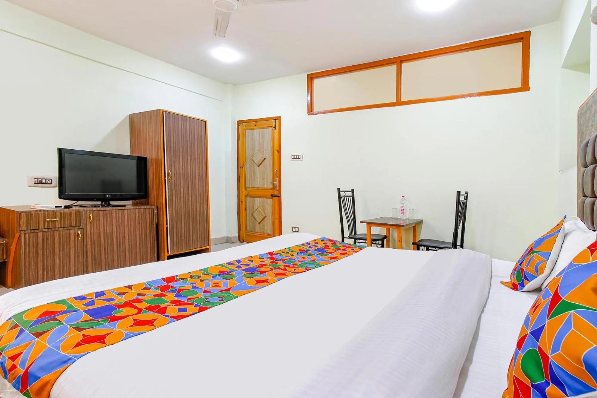 Bed in FabHotel Grand Comforts