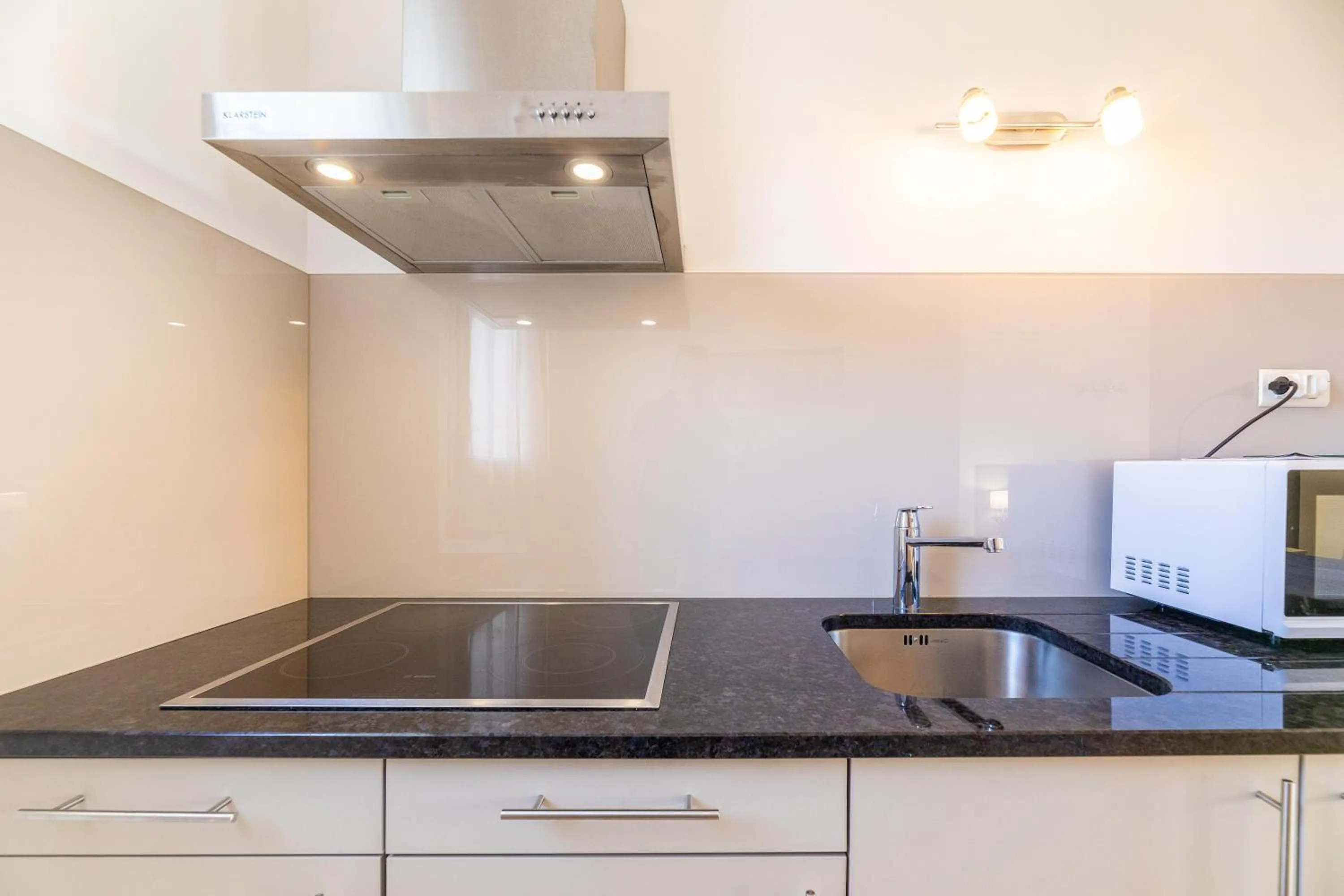 Kitchen or kitchenette in Les Alizés Résidence & Spa