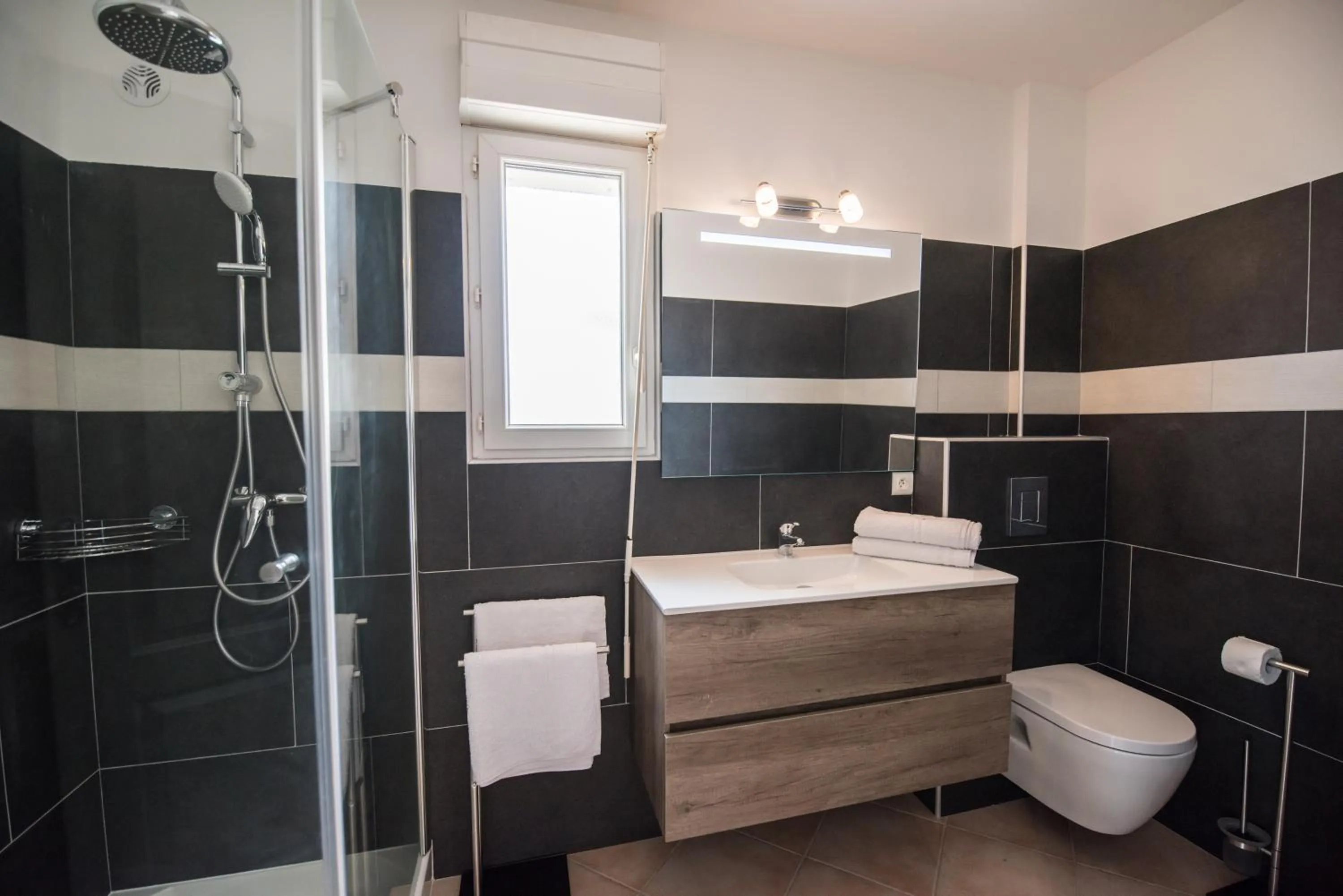 Shower in Les Alizés Résidence & Spa