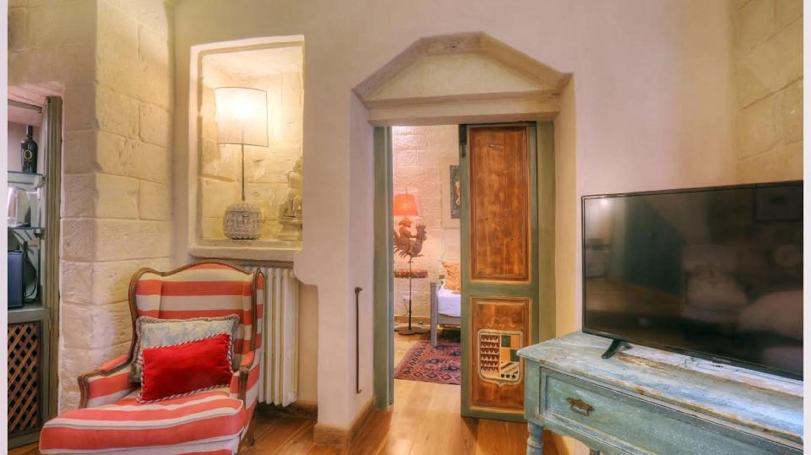 Bed, TV/Entertainment Center in B&B Palazzo Gorgoni