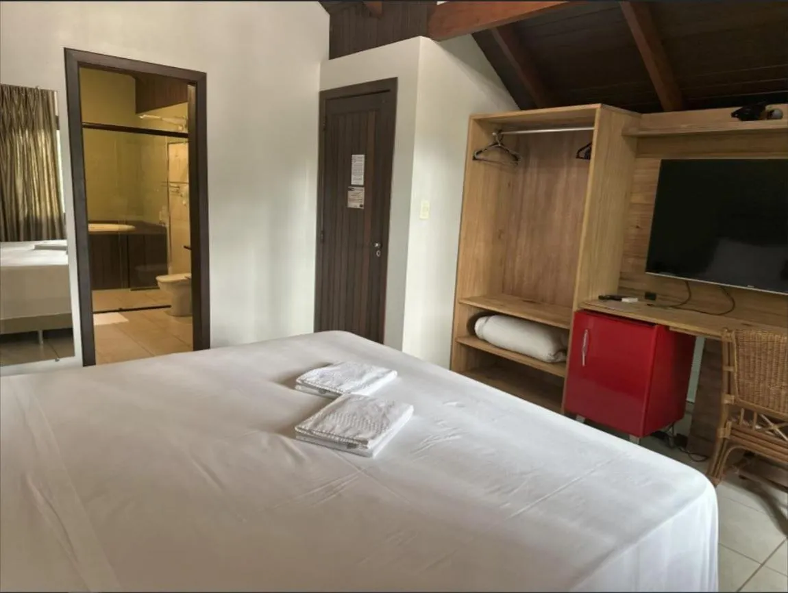 Bed in Pousada Casarão Gastehaus