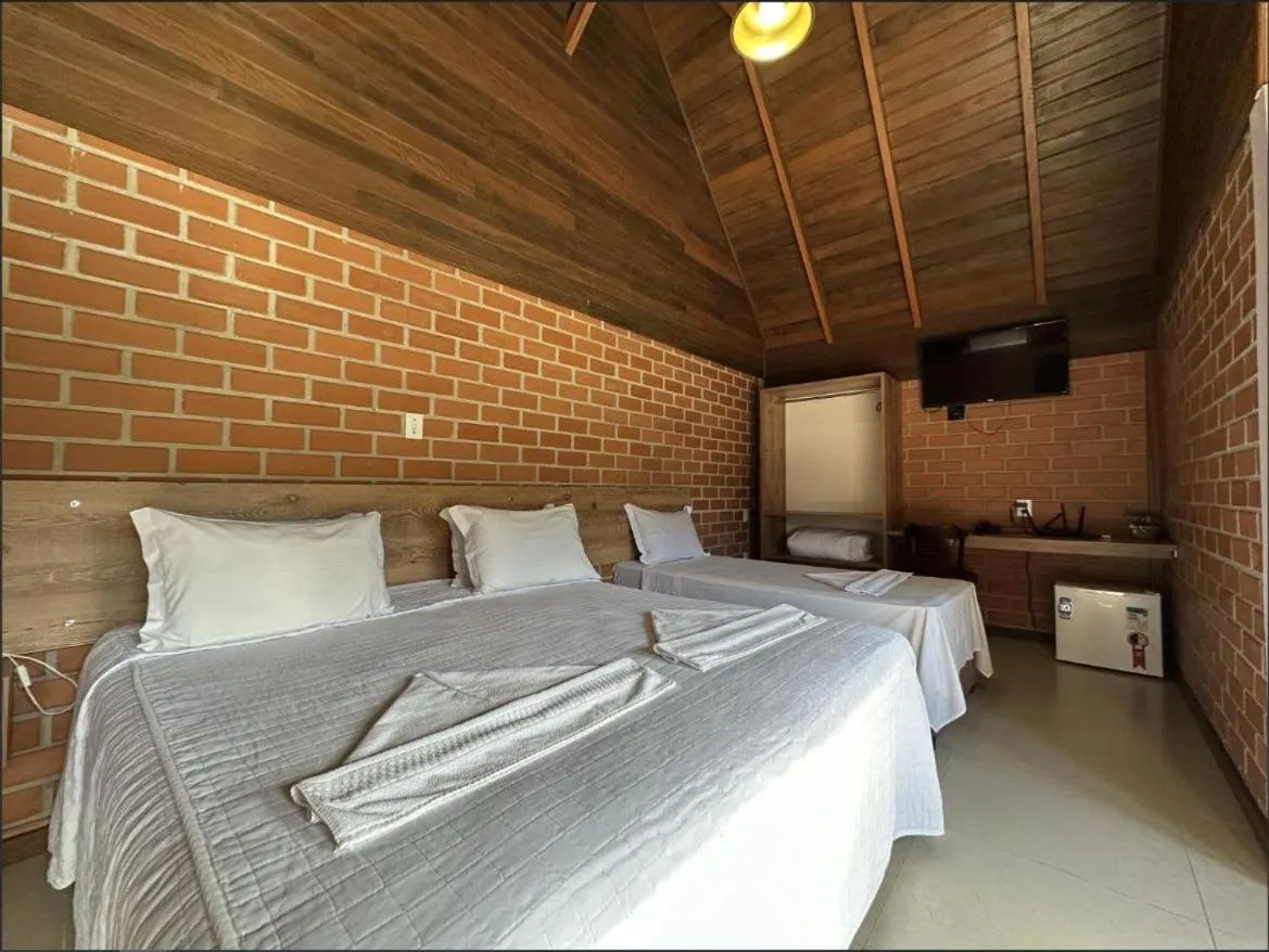 Bed in Pousada Casarão Gastehaus