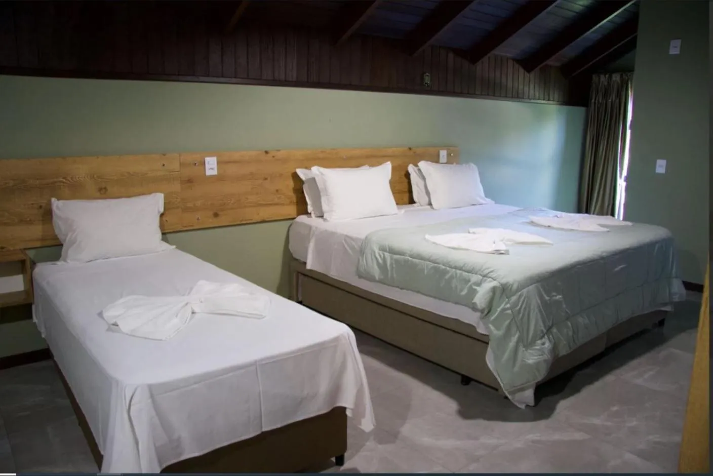 Bed in Pousada Casarão Gastehaus