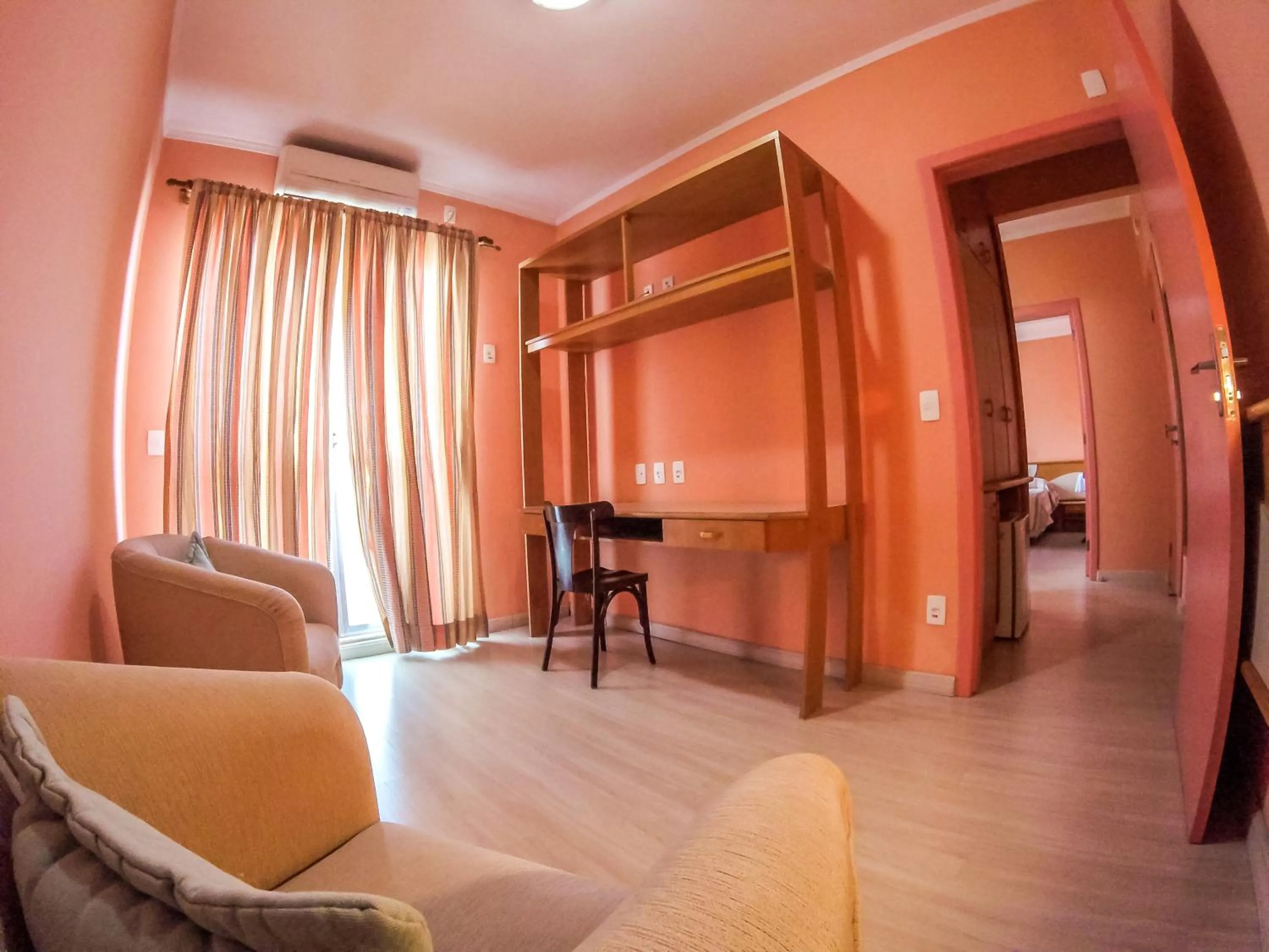 Seating area, Bed in Milão Hotel