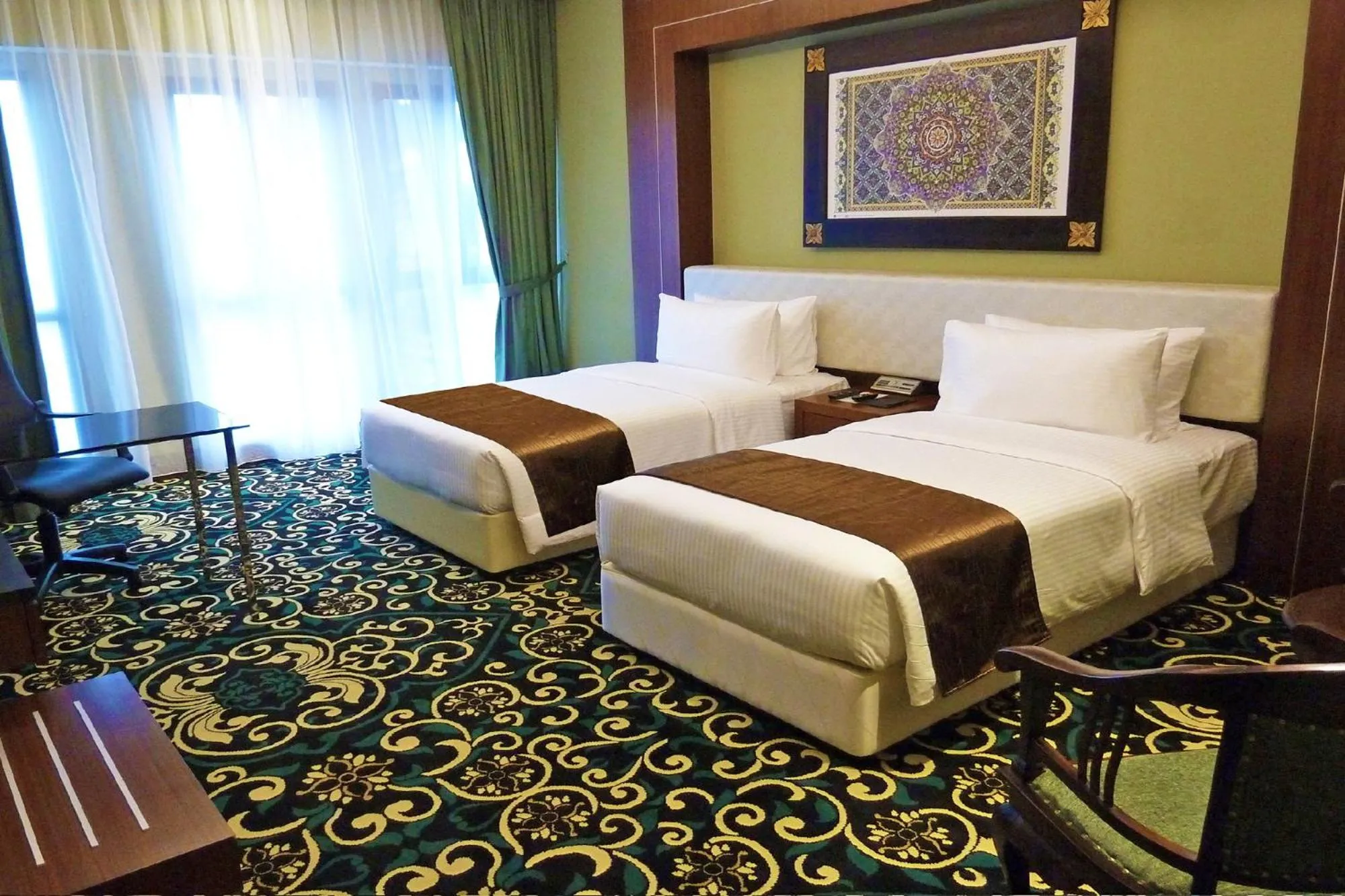 Bed in Mudzaffar Hotel