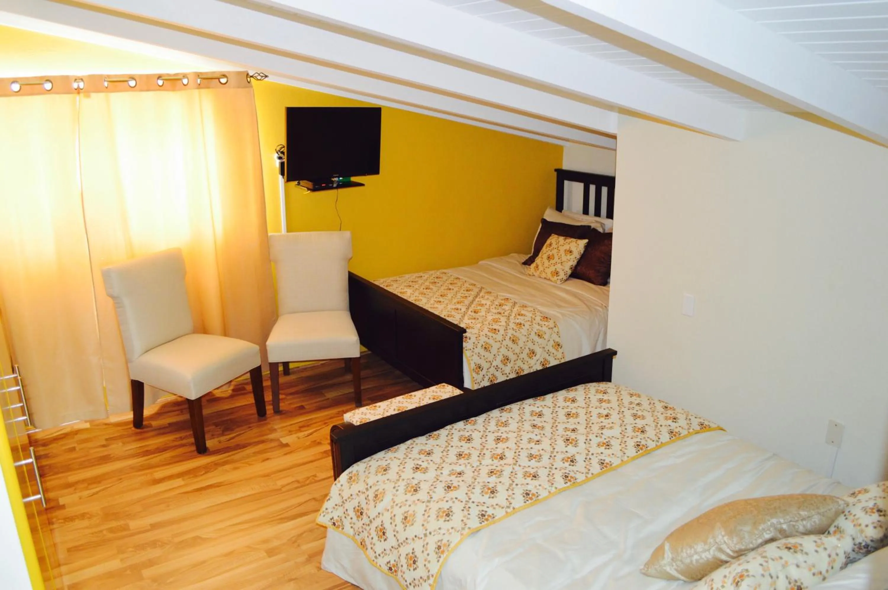 Photo of the whole room, Bed in Eve's Residence