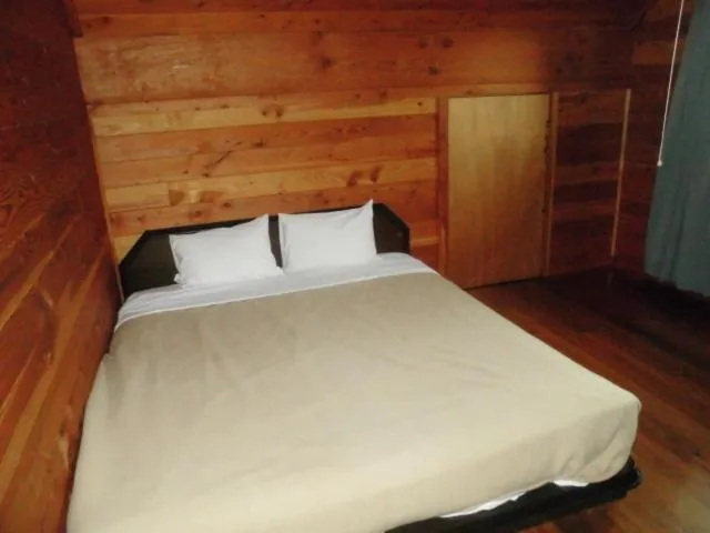 Bed in Log Cottage Villa Happo