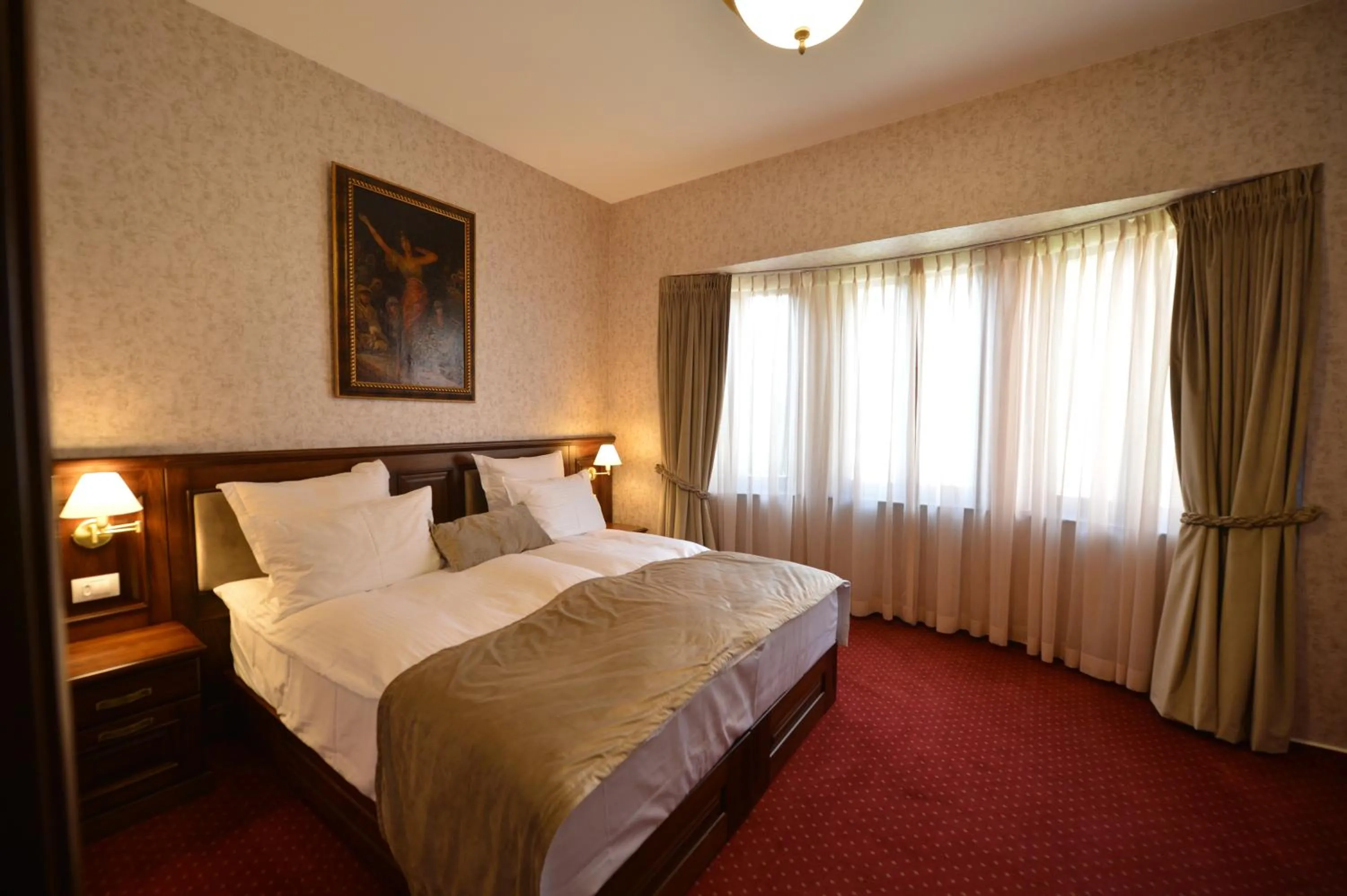 Bed in Noblesse Boutique Resort