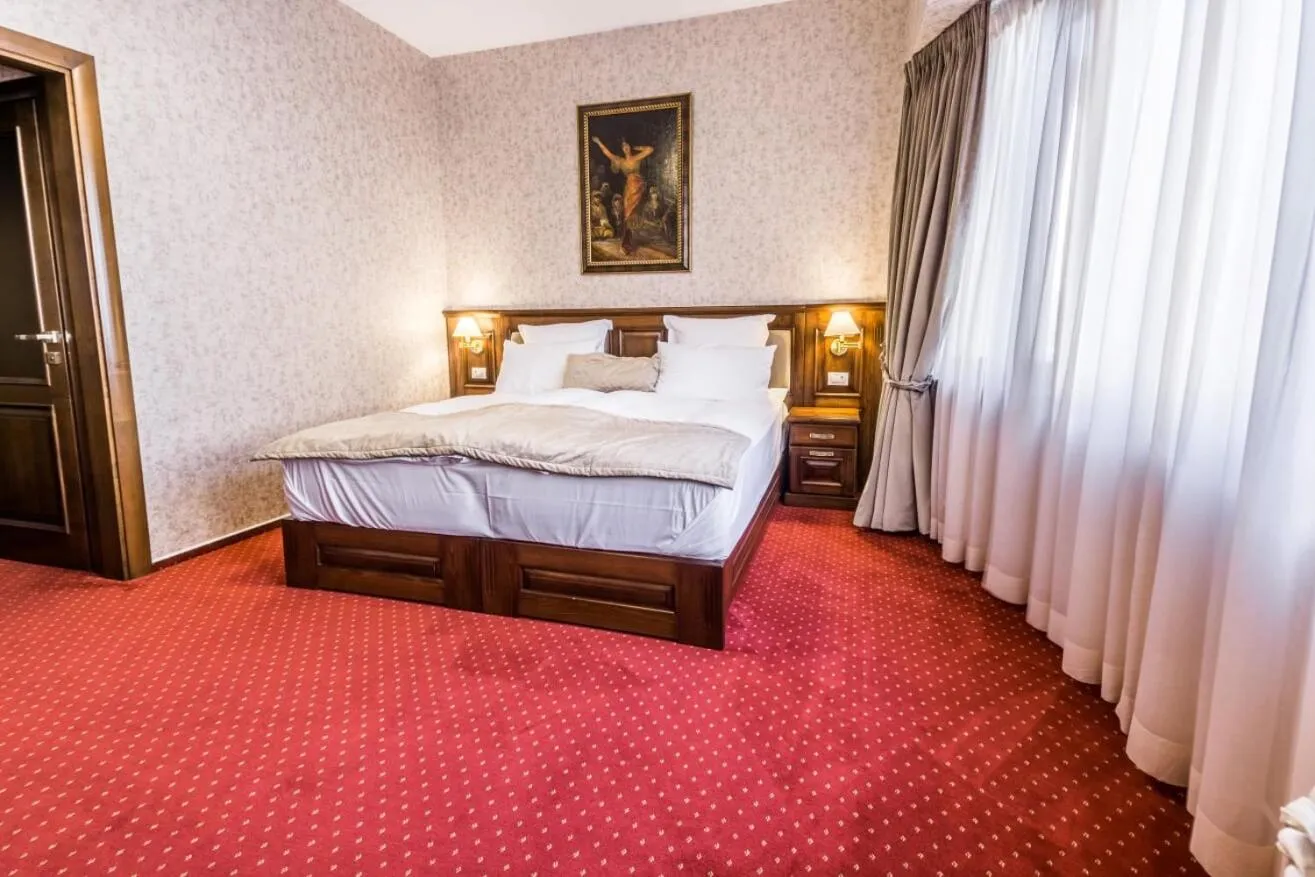 Bed in Noblesse Boutique Resort