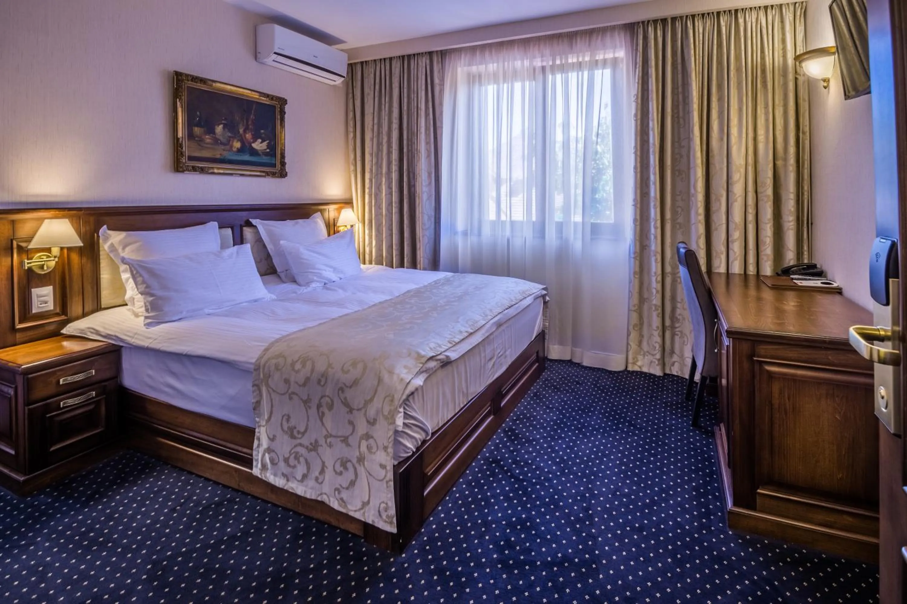 Bed in Noblesse Boutique Resort