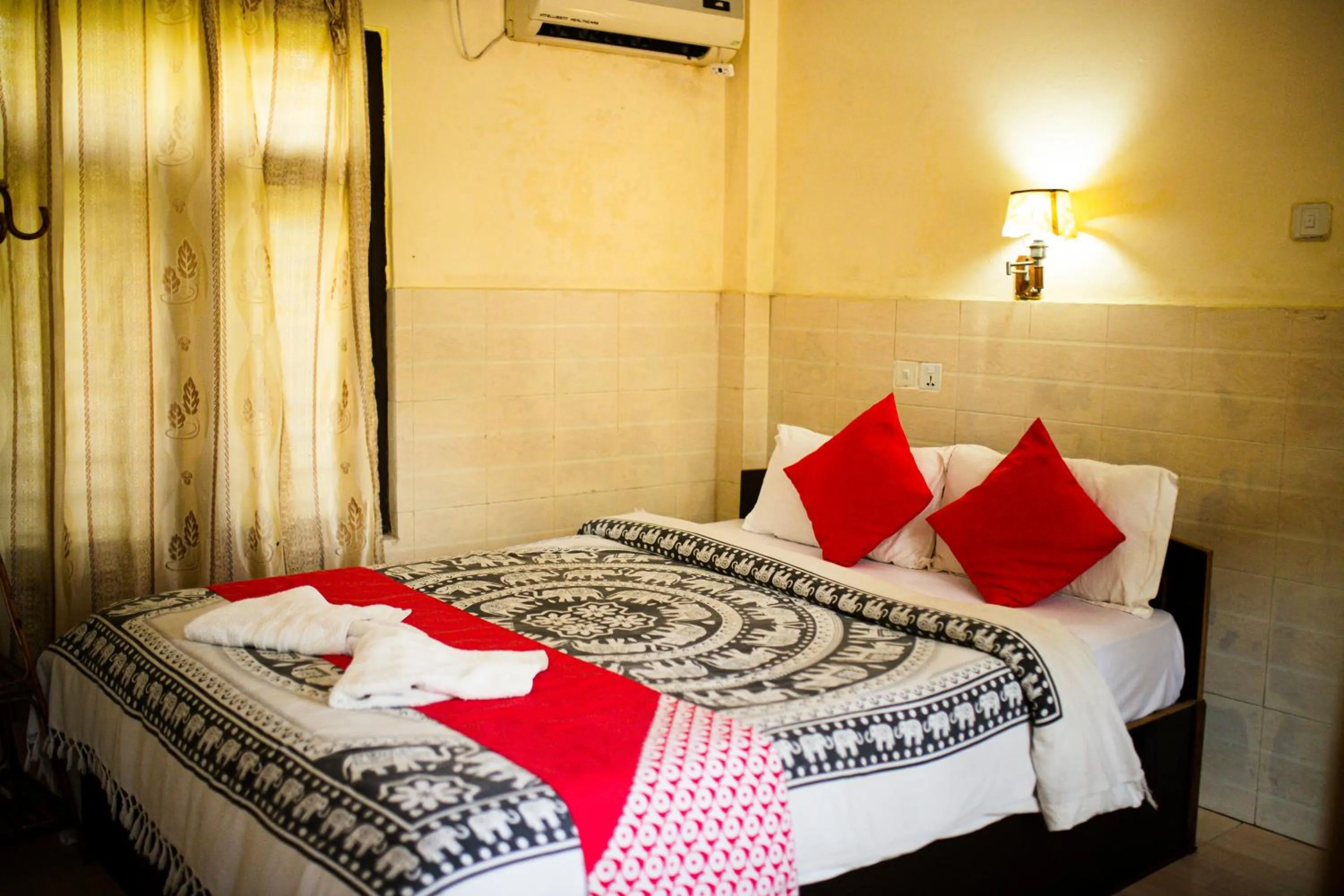 Bed in Chitwan Riverside Resort