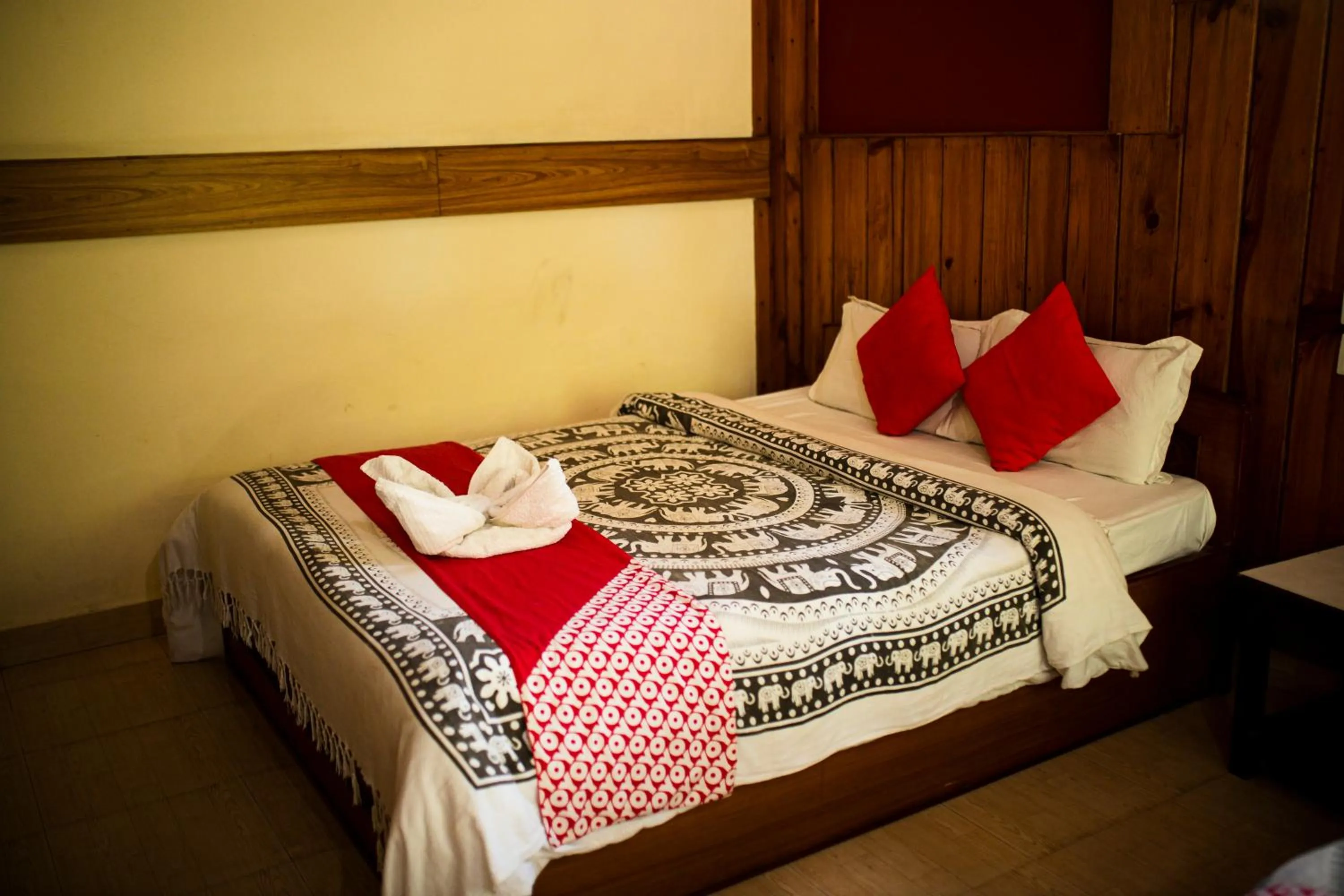 Bed in Chitwan Riverside Resort
