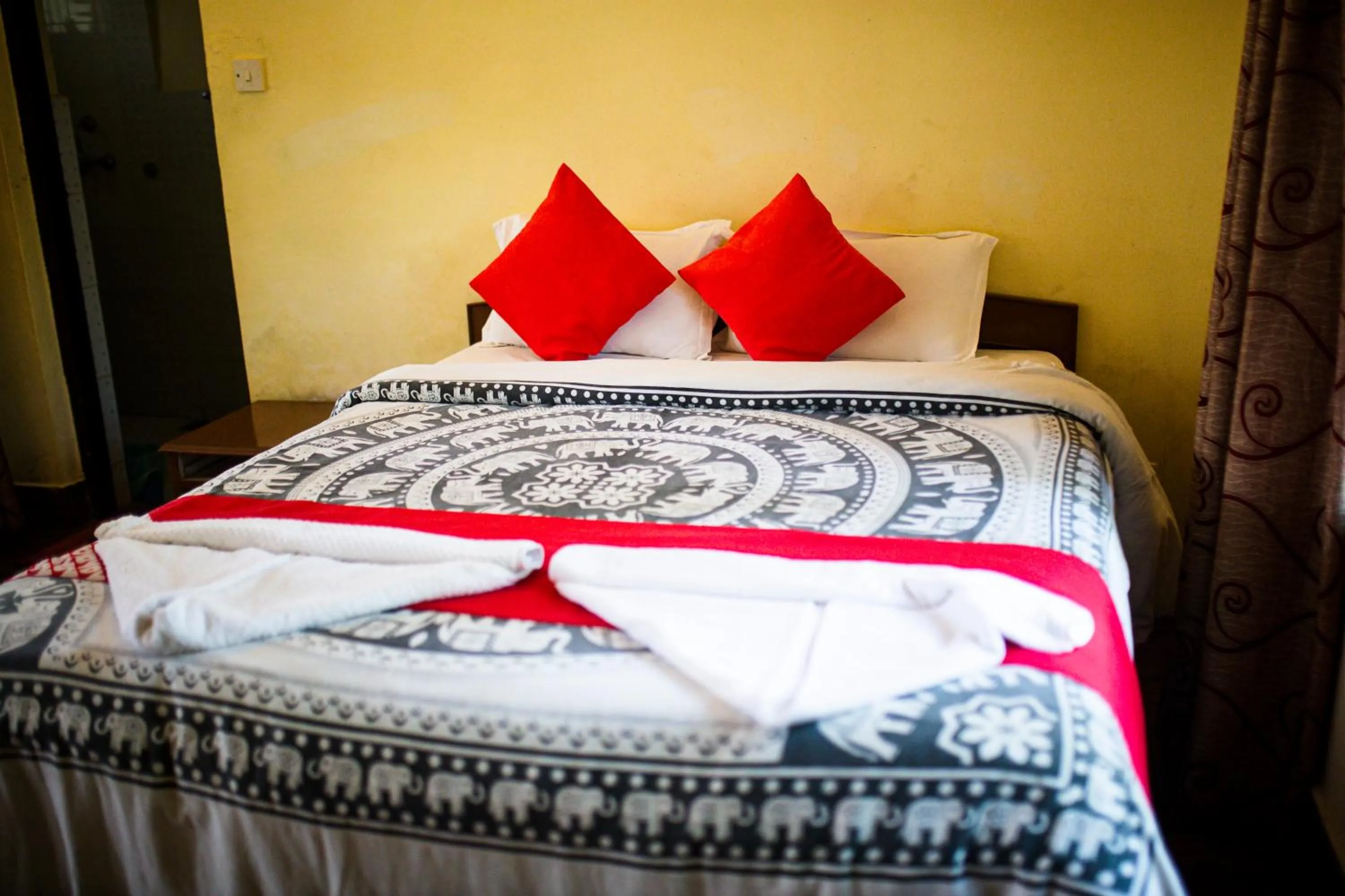 Bed in Chitwan Riverside Resort