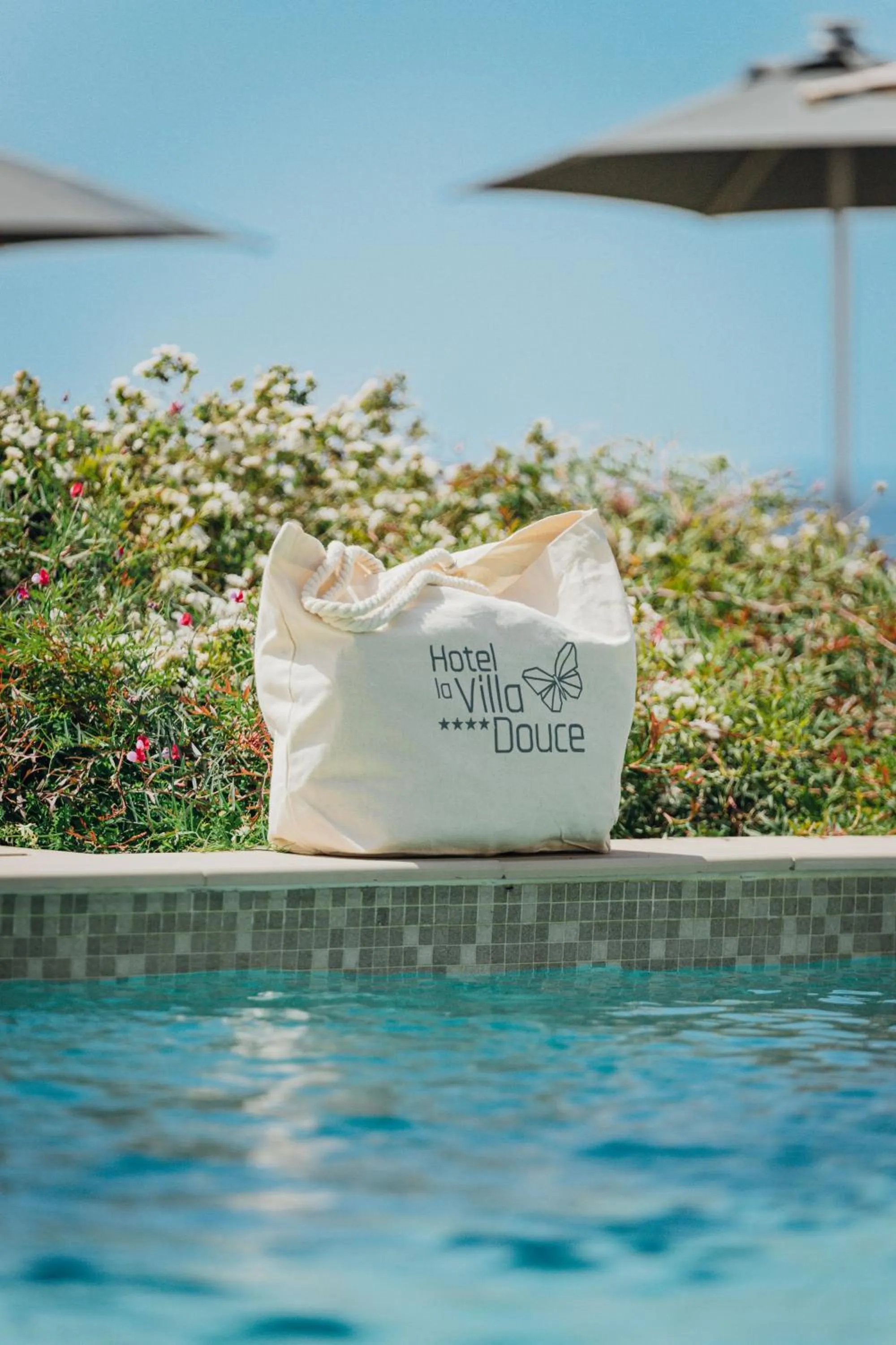 Swimming pool in Hôtel La Villa Douce