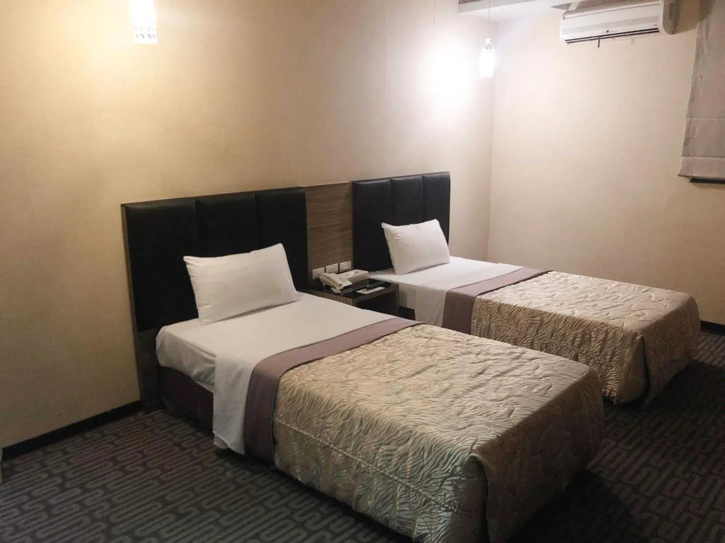 Bed in Esun Villa Hotel