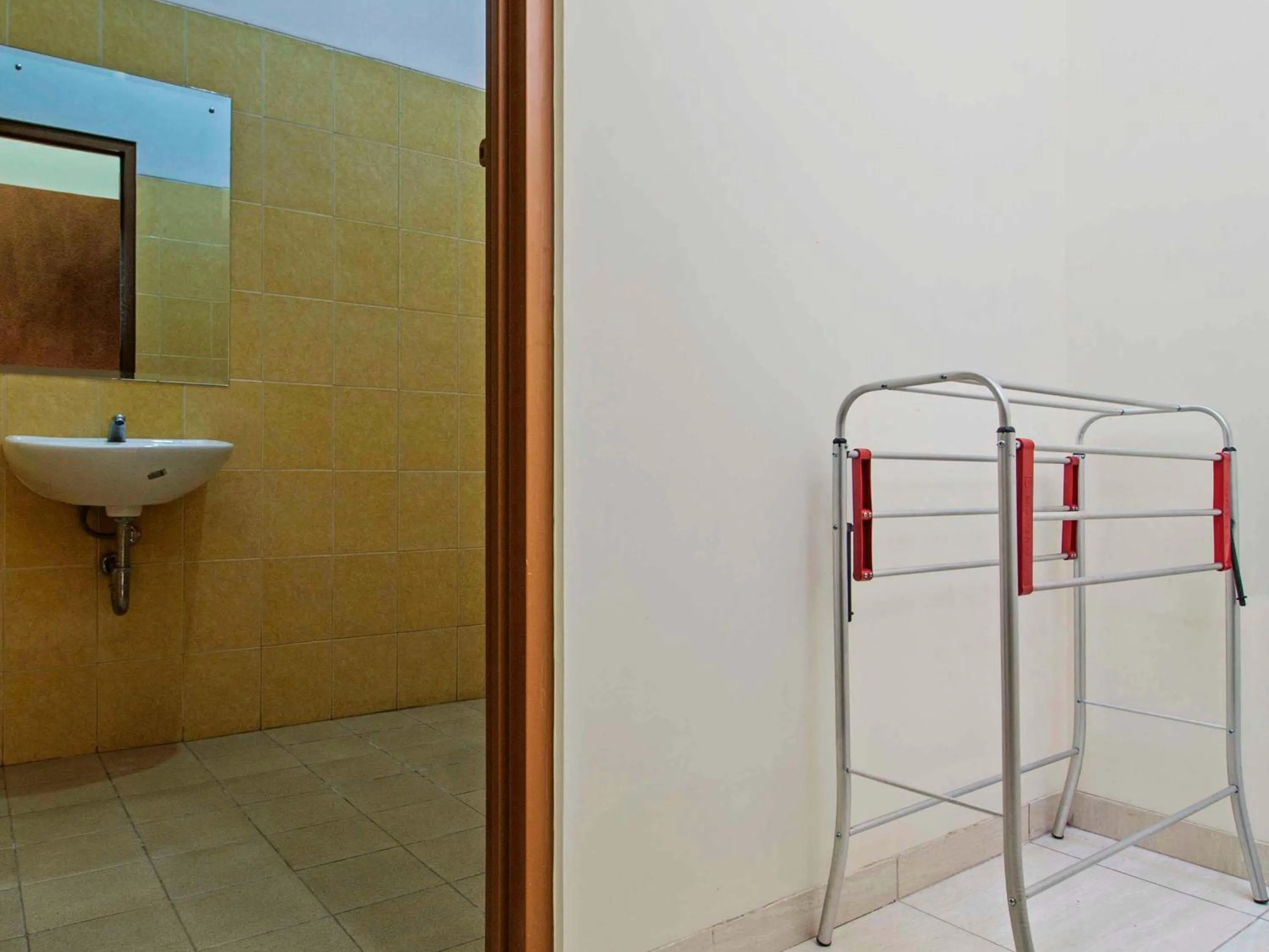 Bathroom in RedDoorz Syariah near Mercu Buana University