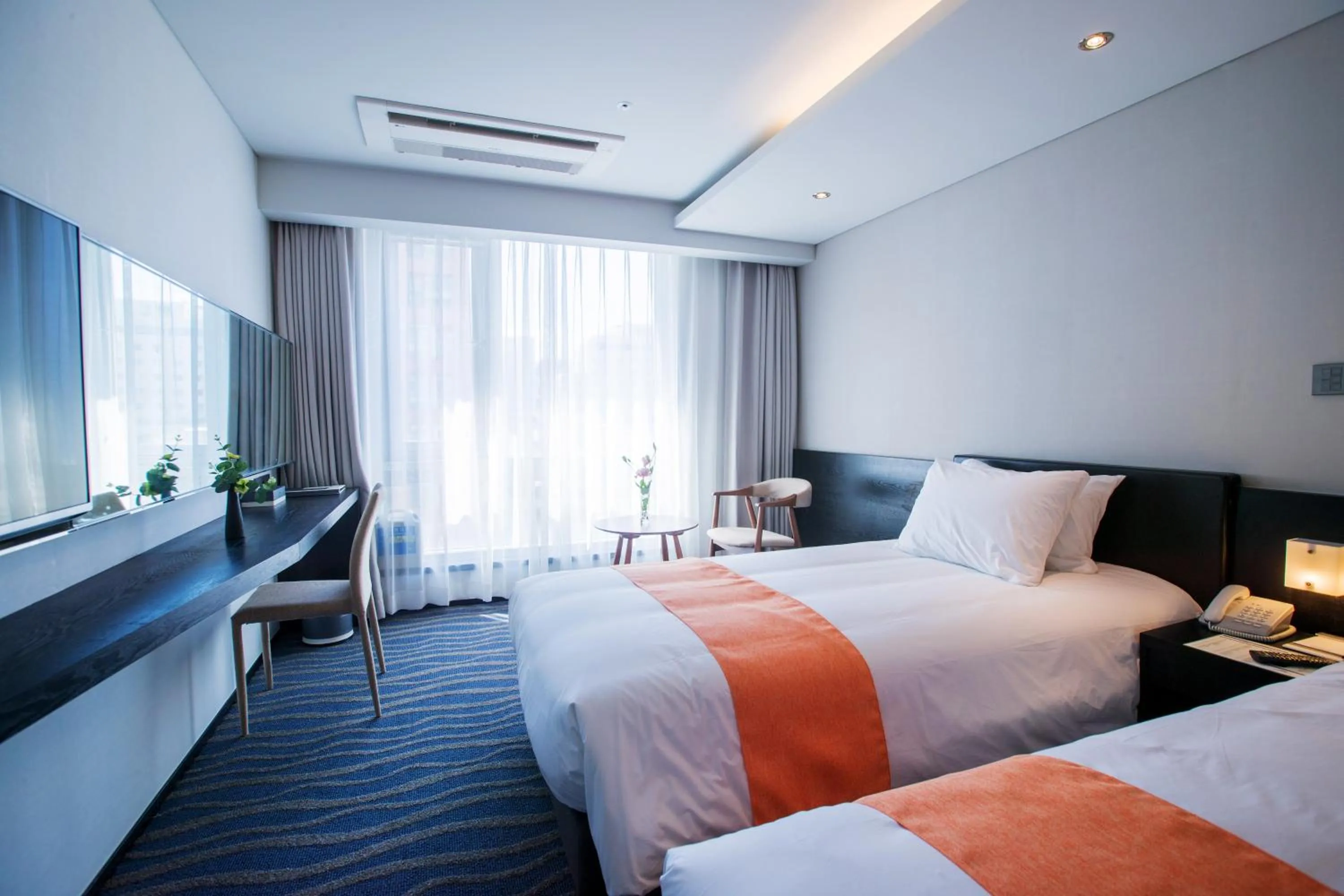 Bed in Gloucester Hotel Jeju