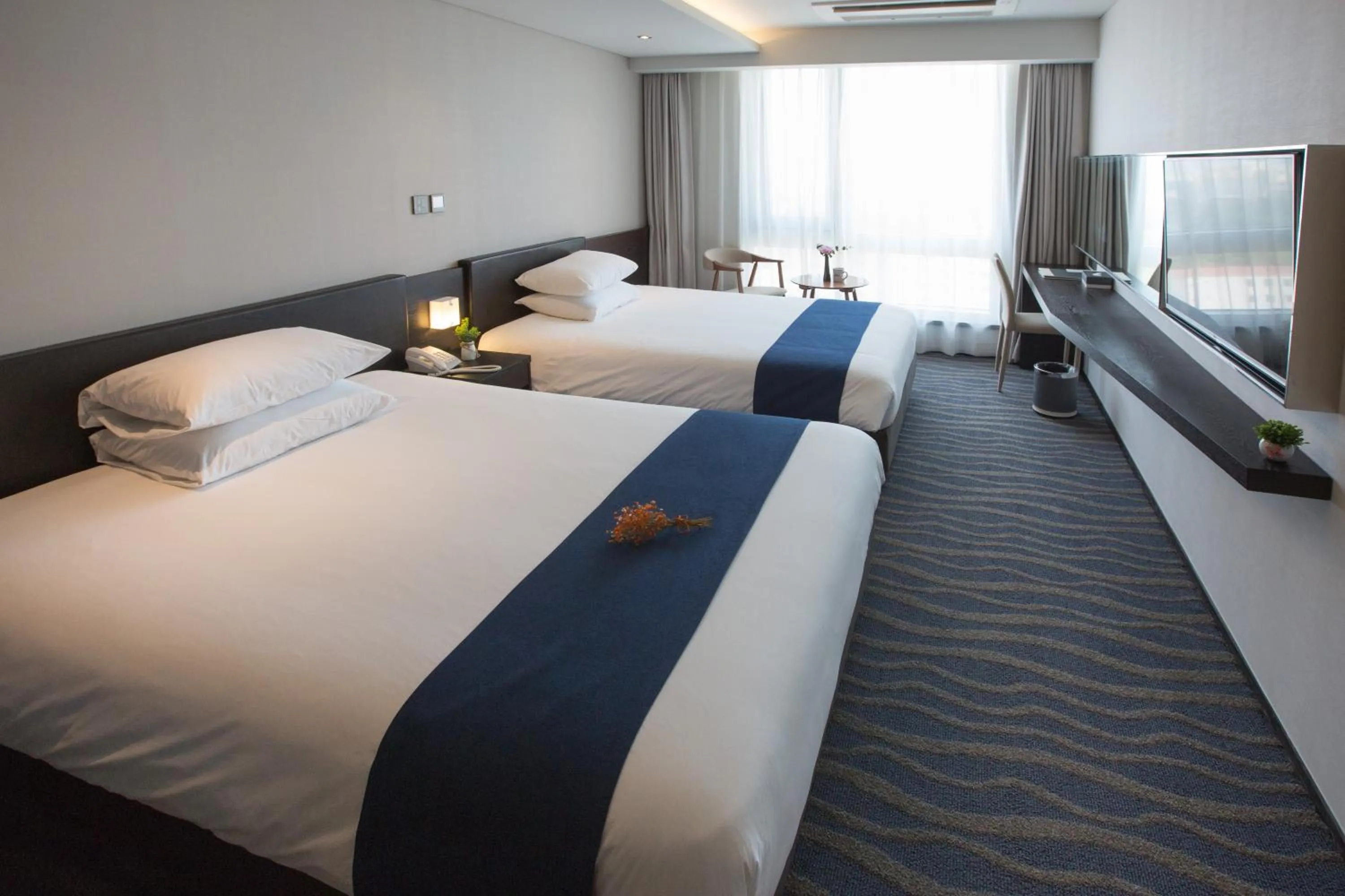 Bed in Gloucester Hotel Jeju