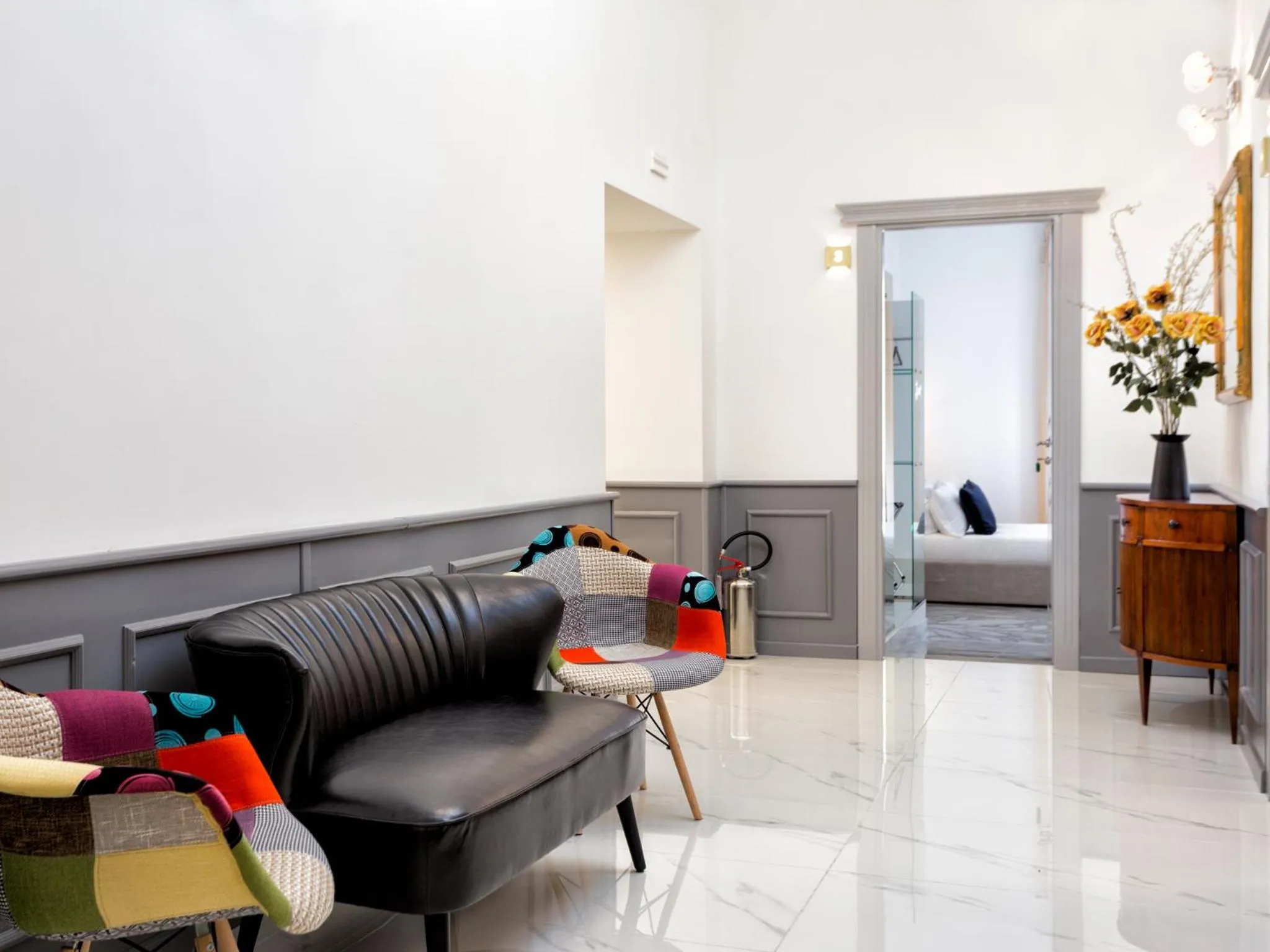 Communal lounge/ TV room in Queen Palace Suites