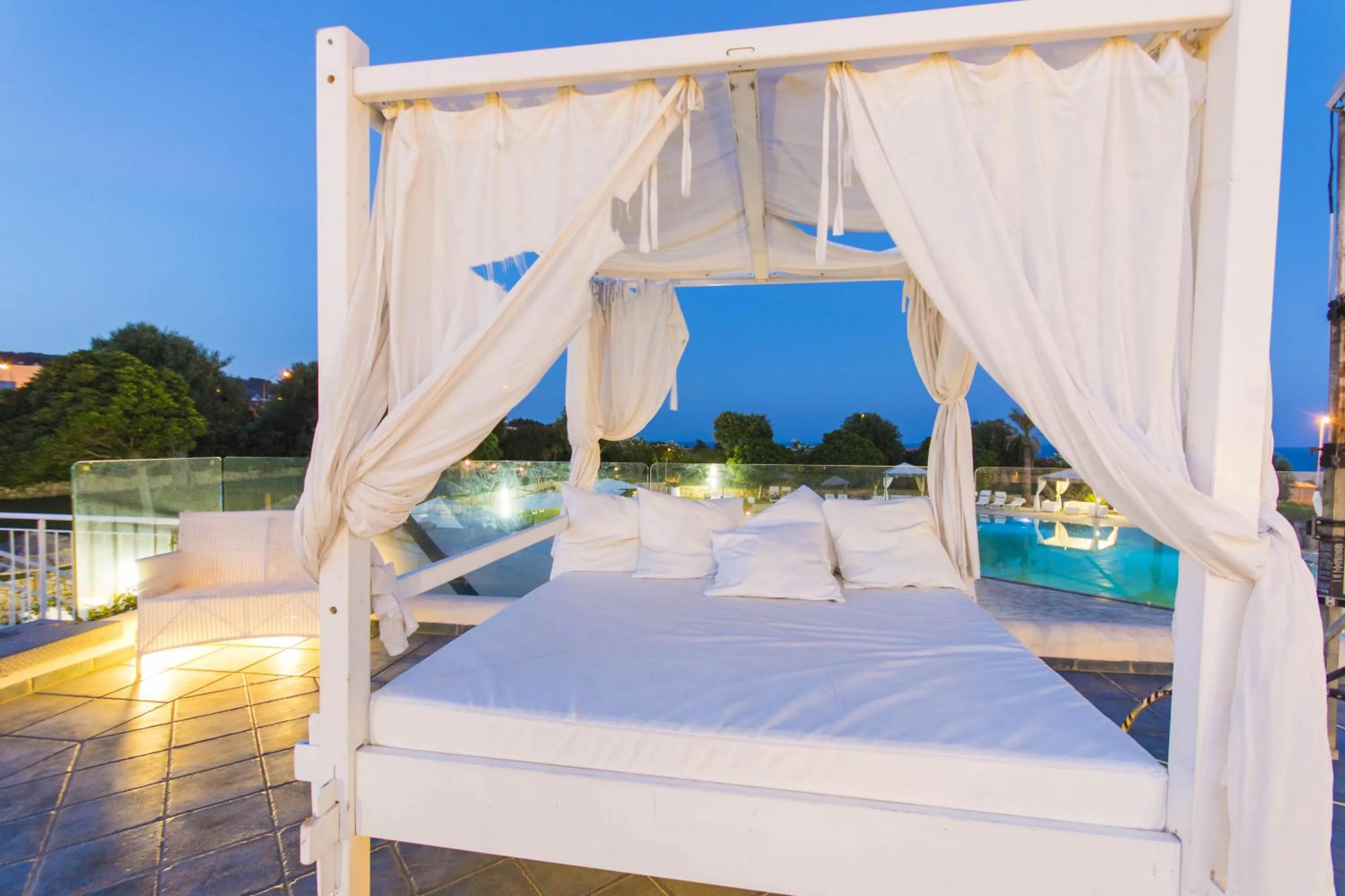 Seating area, Bed in Augustus Resort