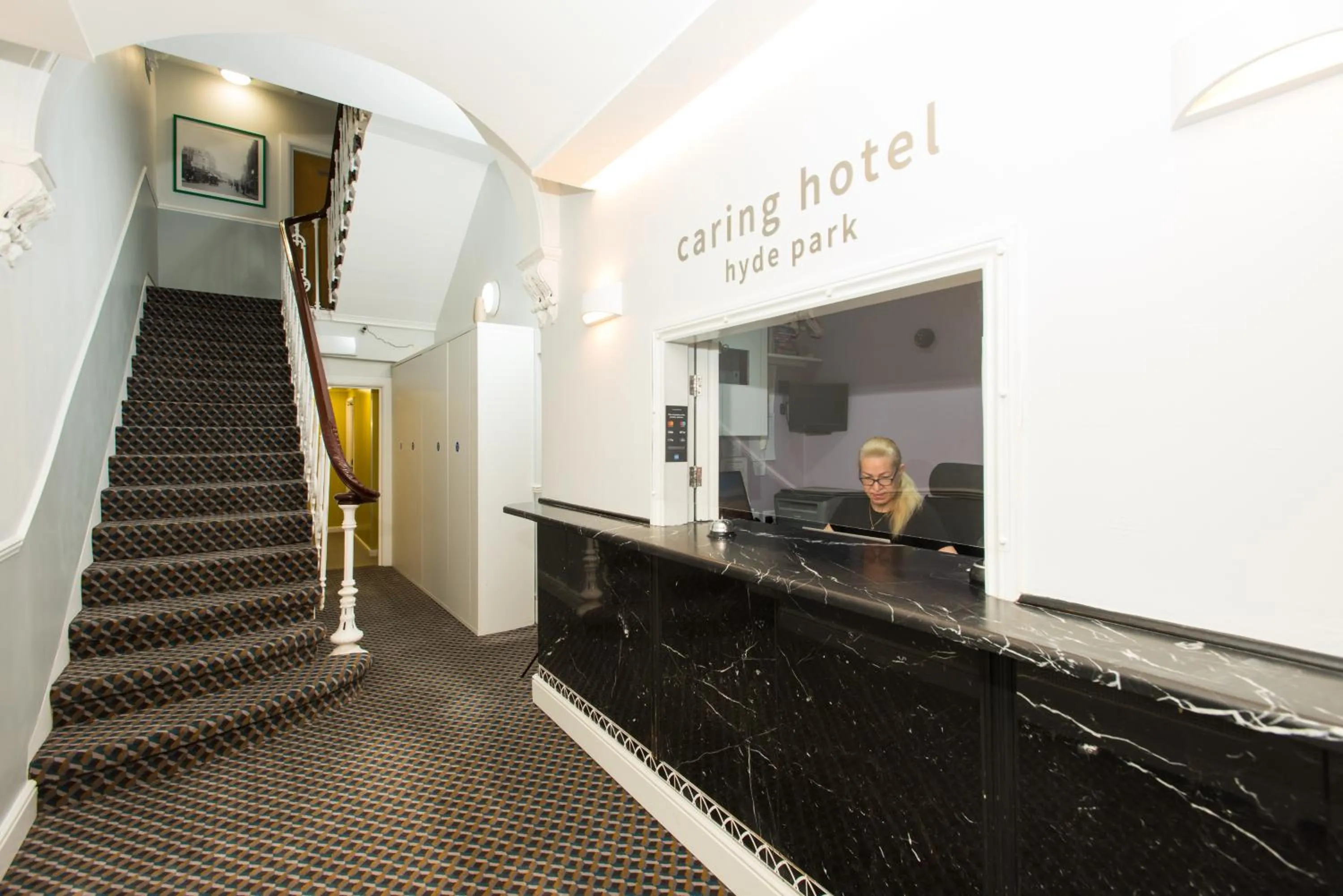 Lobby or reception in Caring Hotel