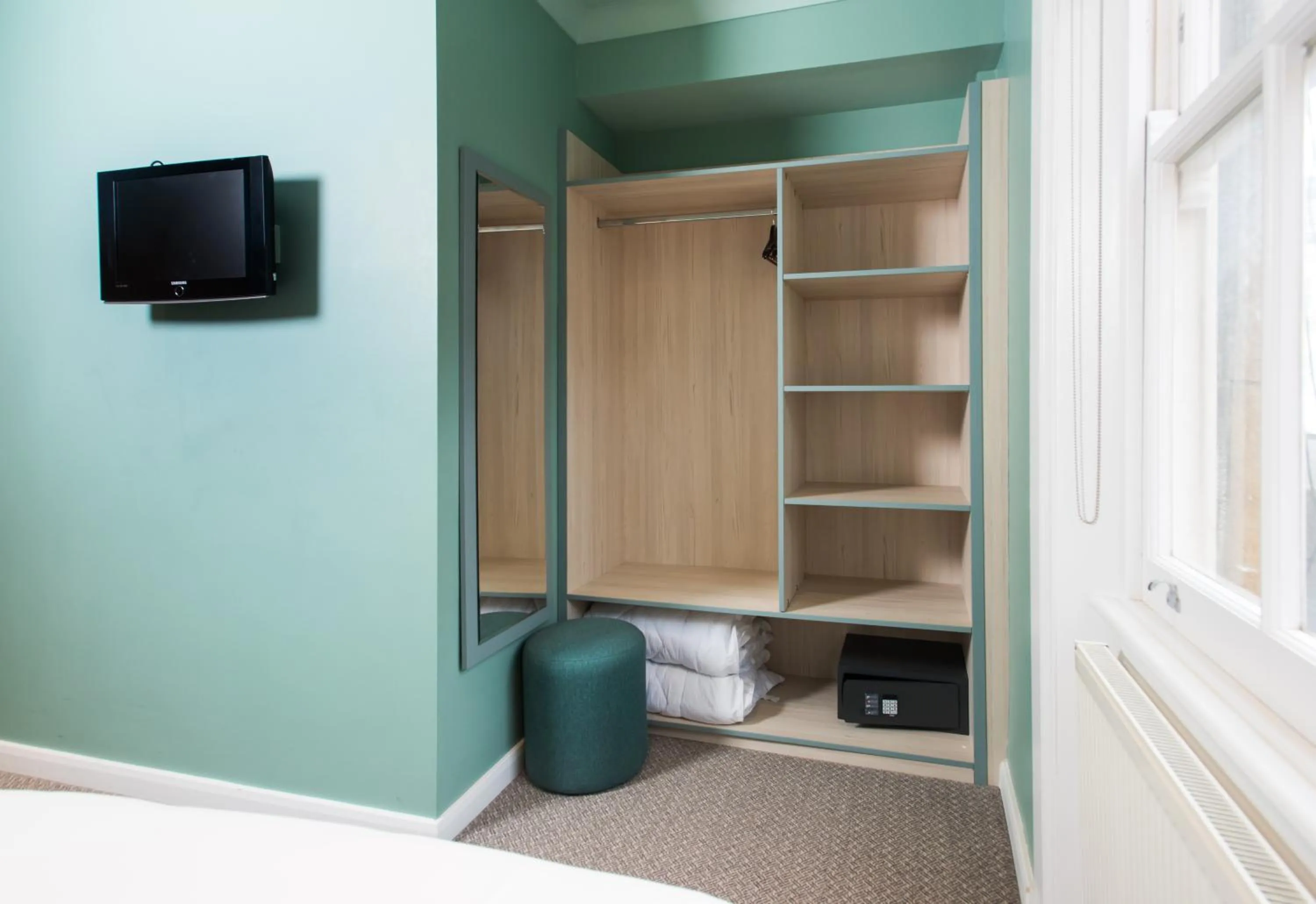 wardrobe, Bed in Caring Hotel