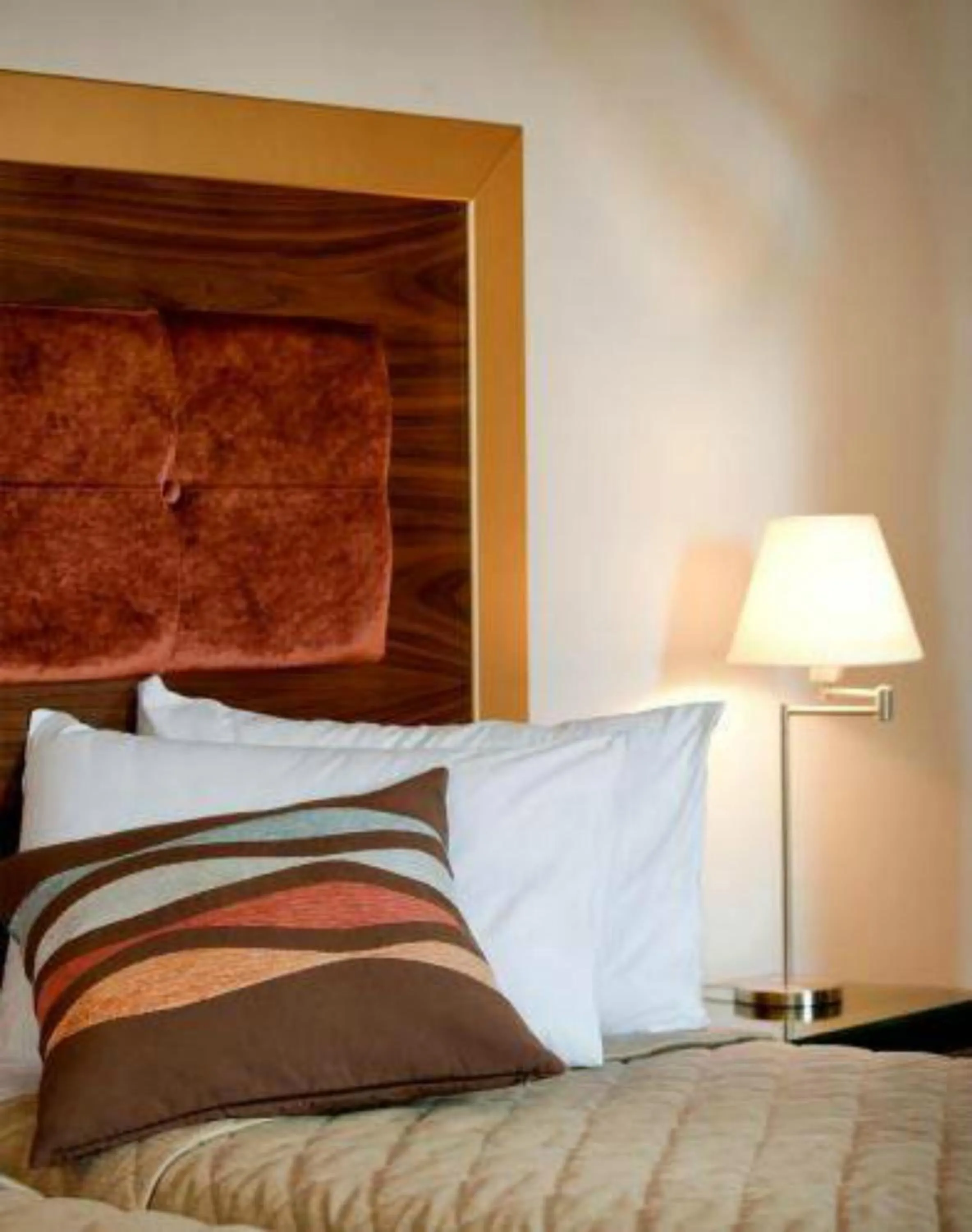 Bed in Dovitel Boutique Hotel