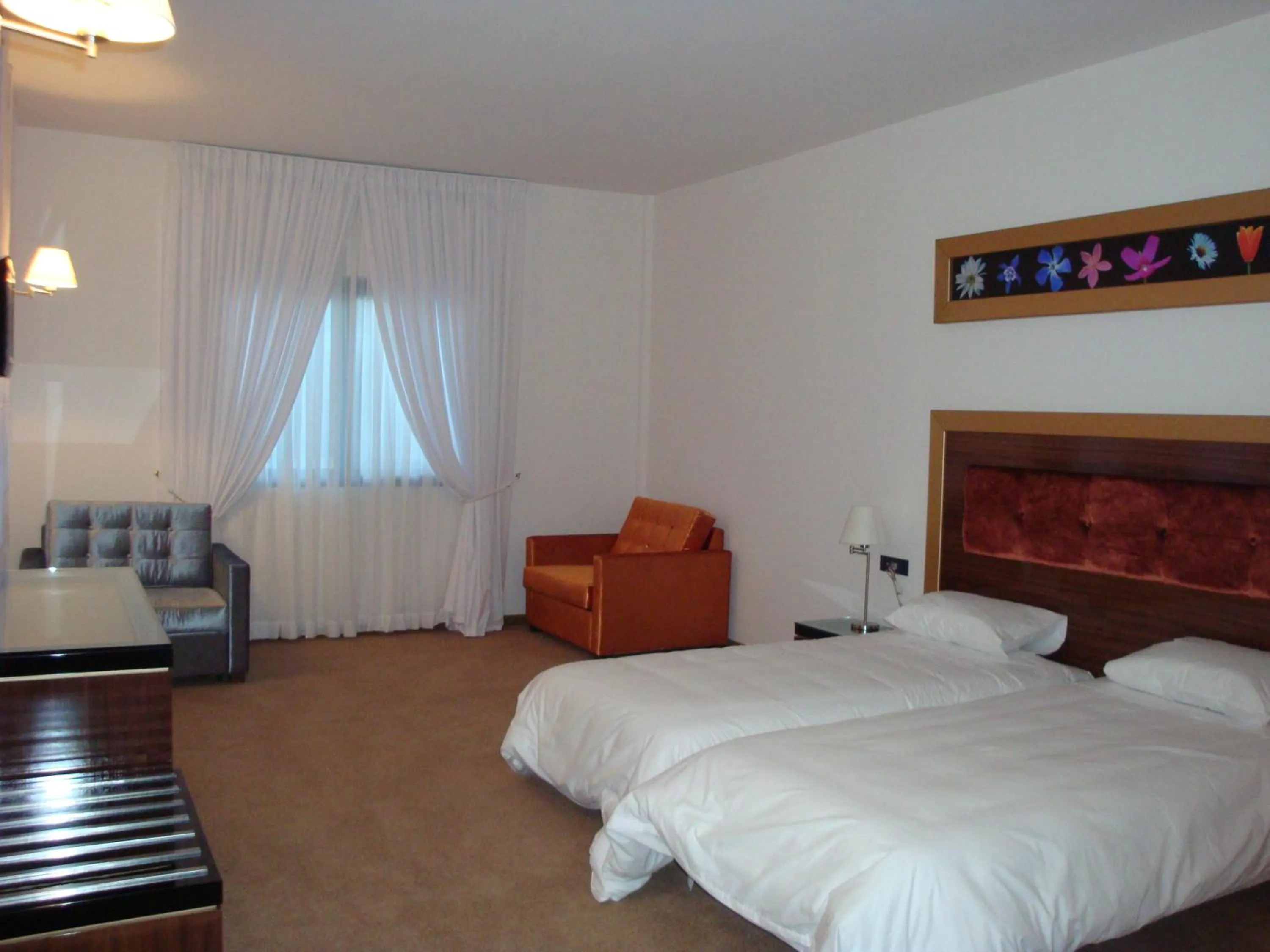 Bedroom in Dovitel Boutique Hotel