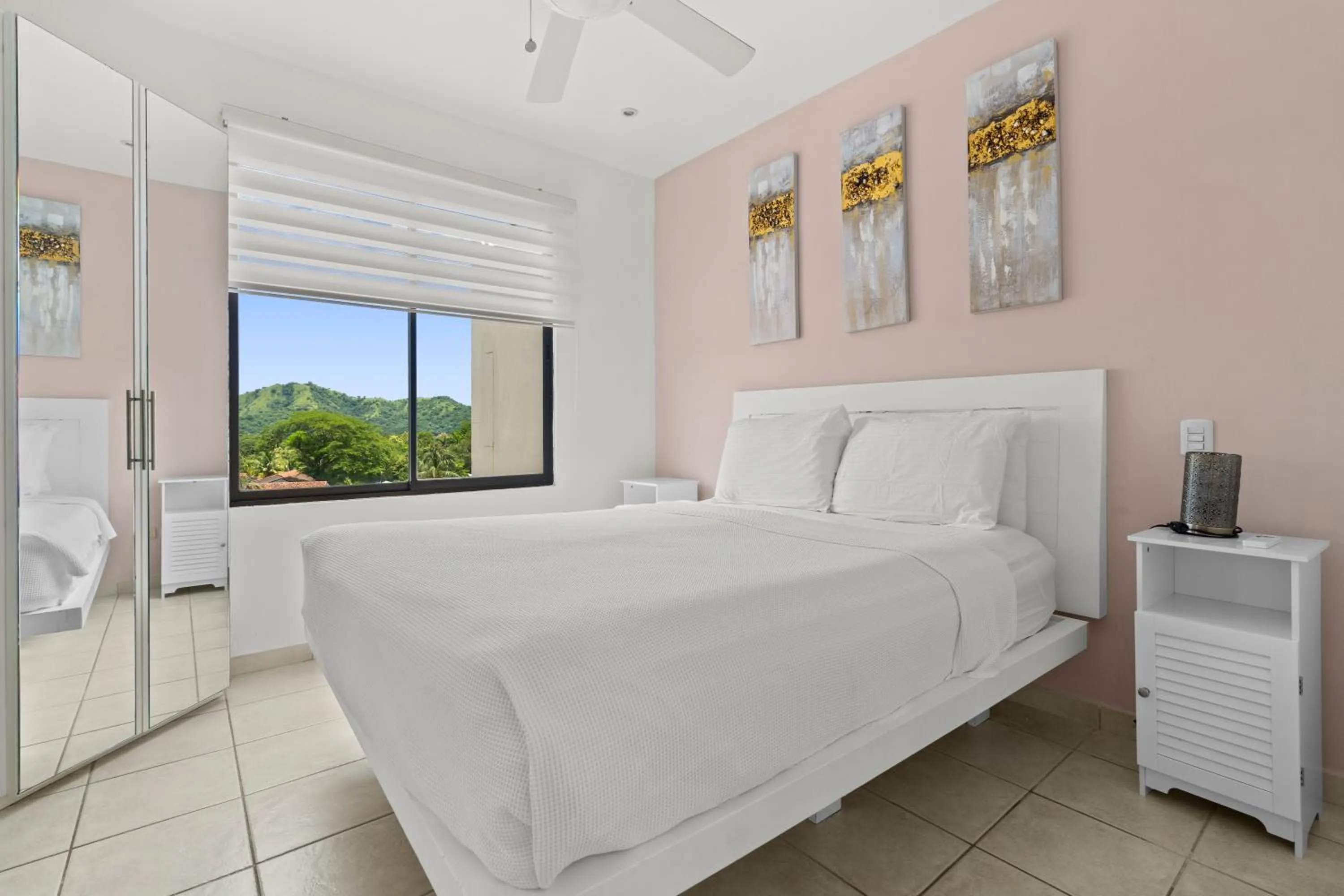 Bed in Tropical Gardens Suites and Apartments