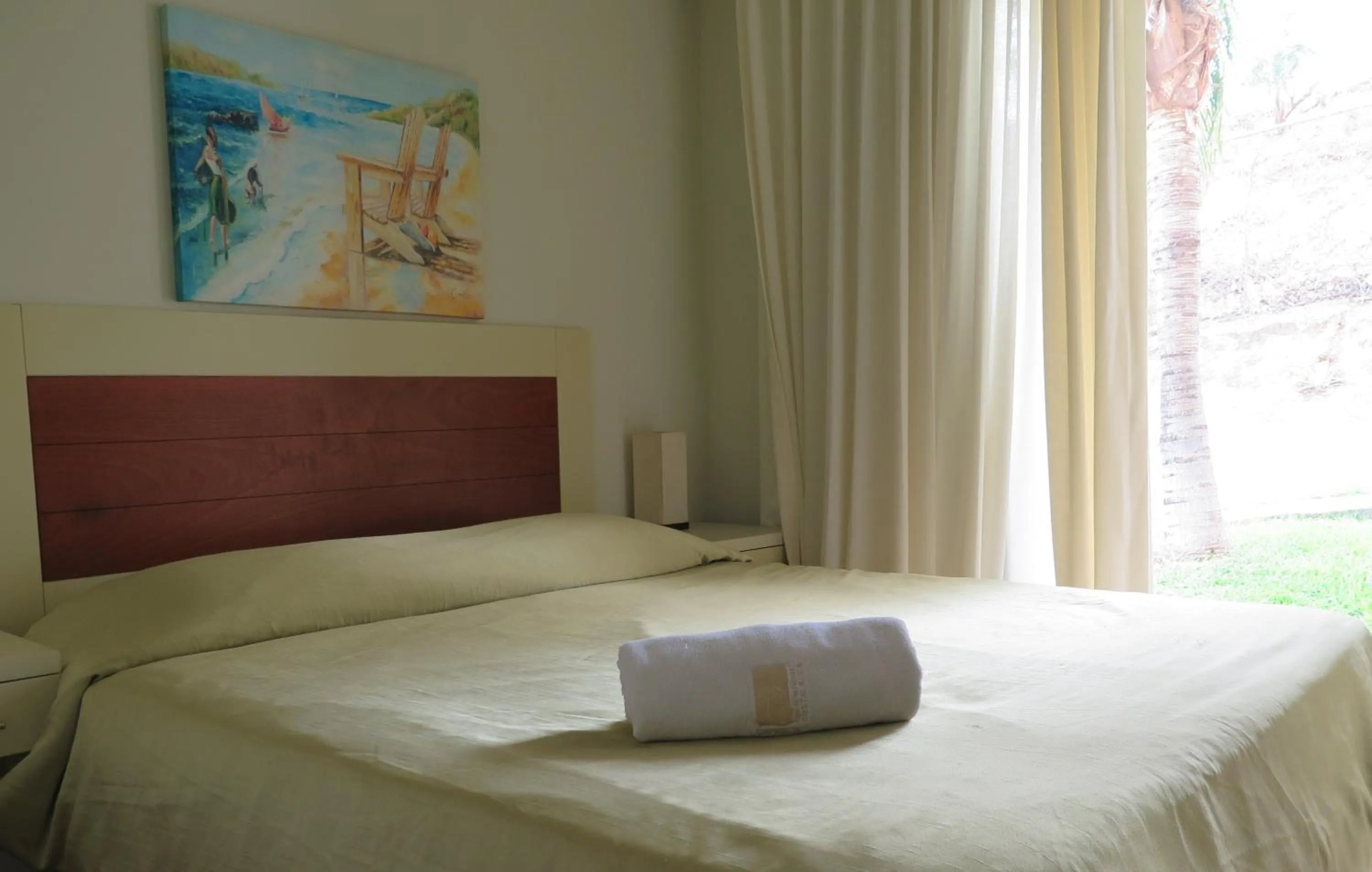 Bed in Tropical Gardens Suites and Apartments