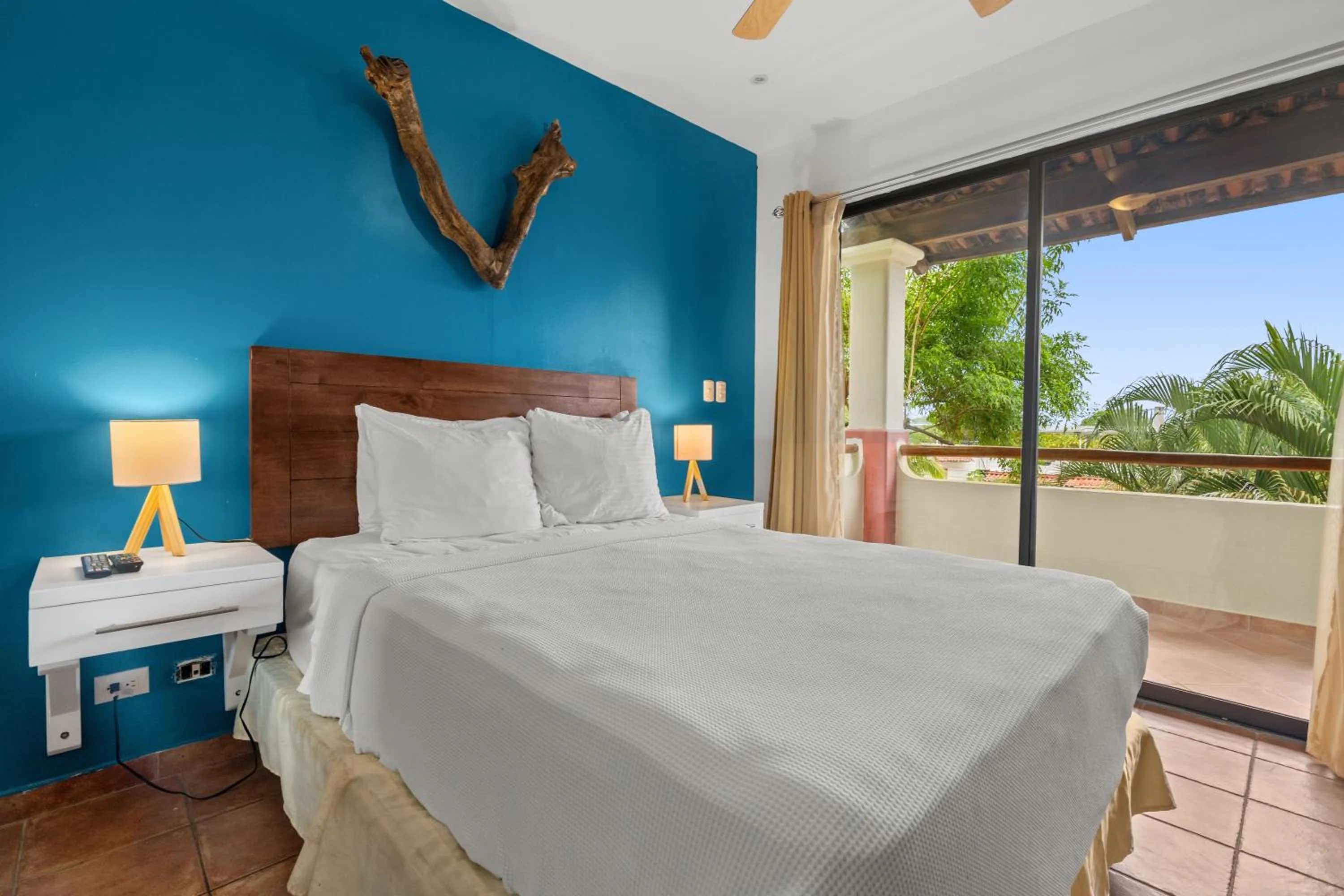 Bed in Tropical Gardens Suites and Apartments