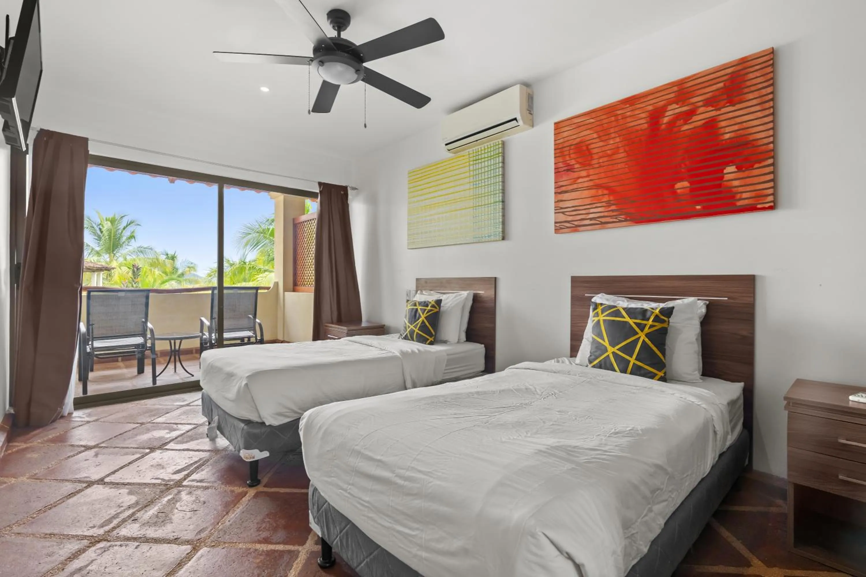 Bed in Tropical Gardens Suites and Apartments