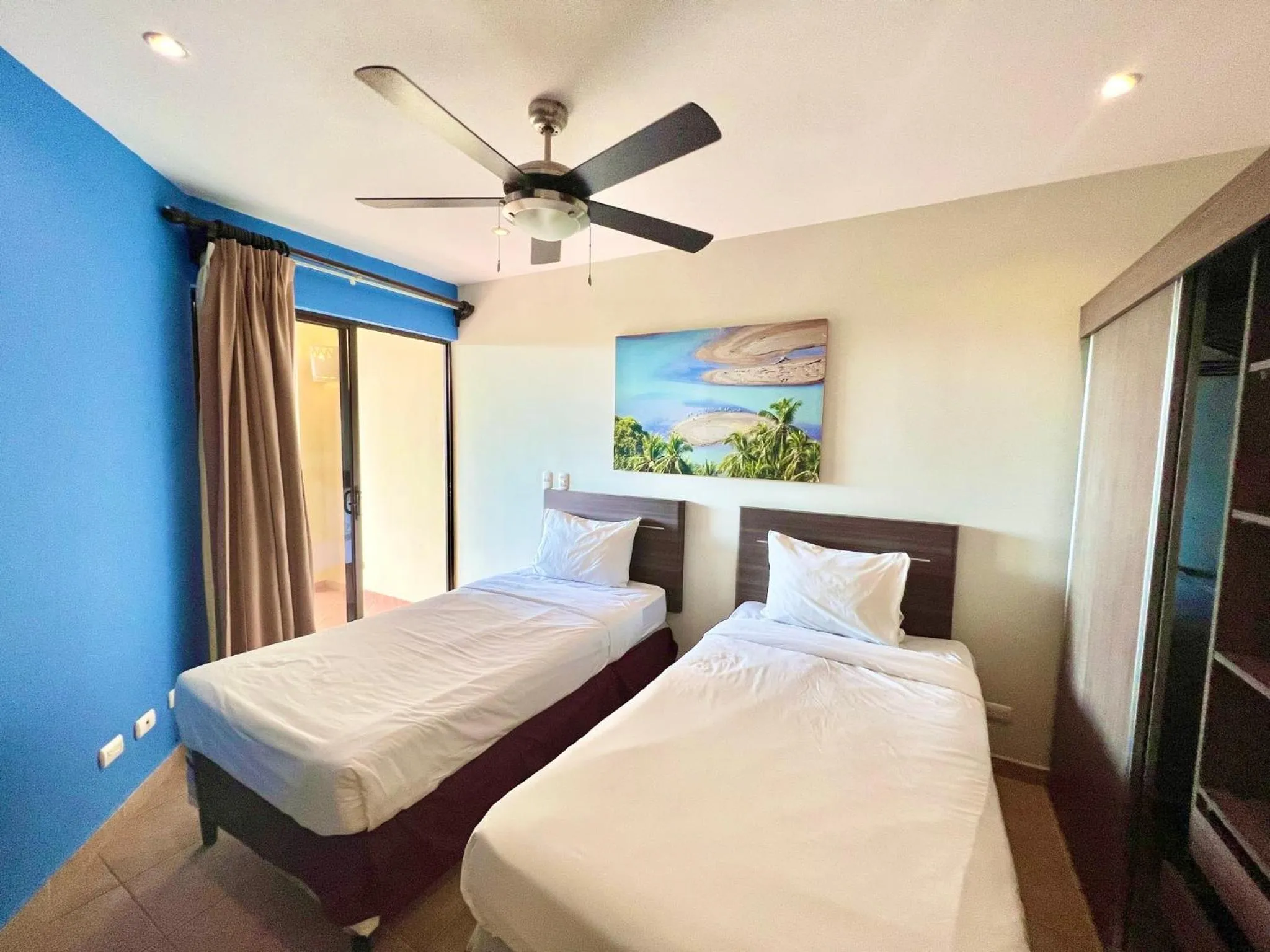 Bed in Tropical Gardens Suites and Apartments