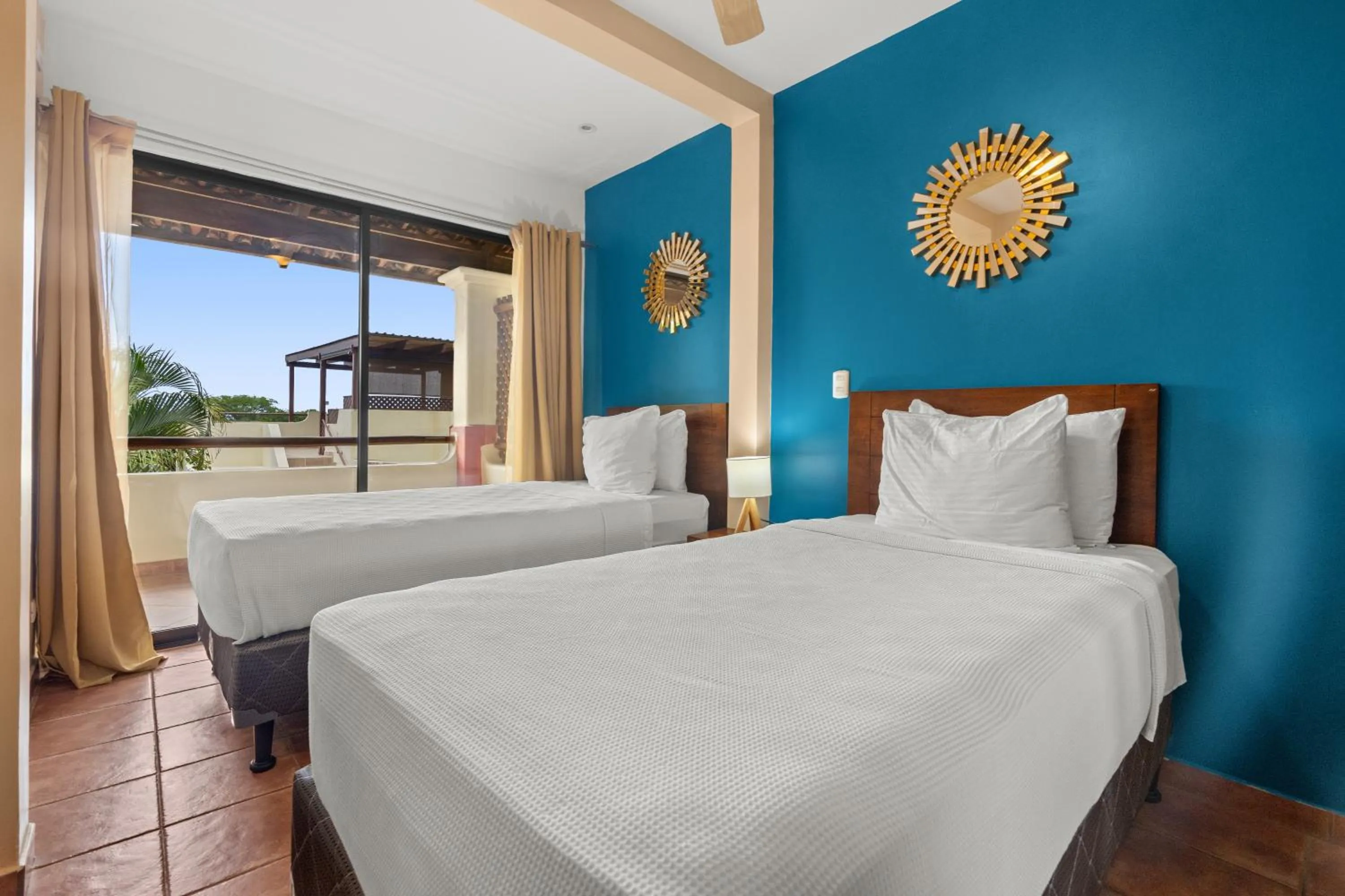 Bed in Tropical Gardens Suites and Apartments