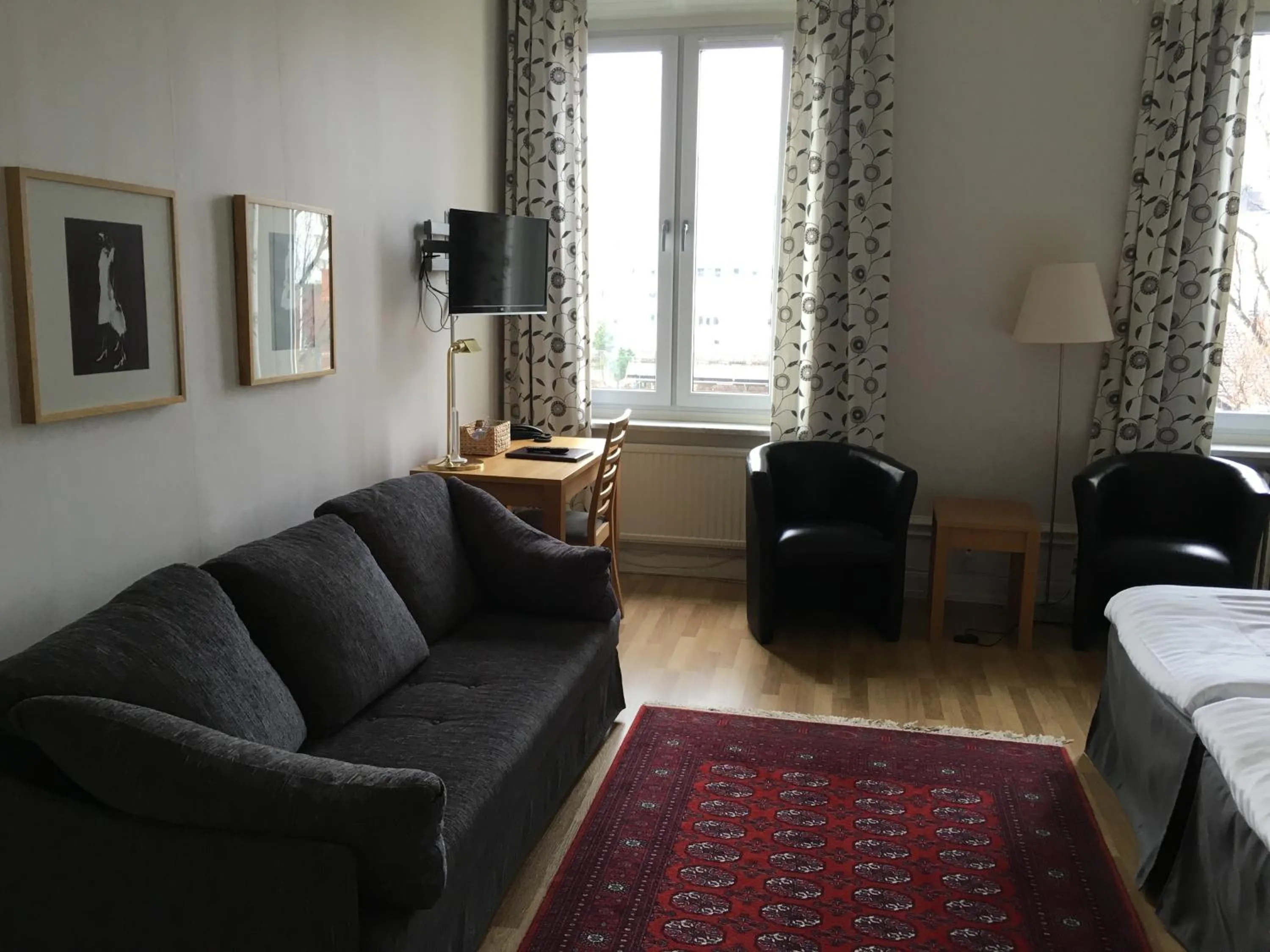 Seating area, Bed in First Hotel City Eskilstuna