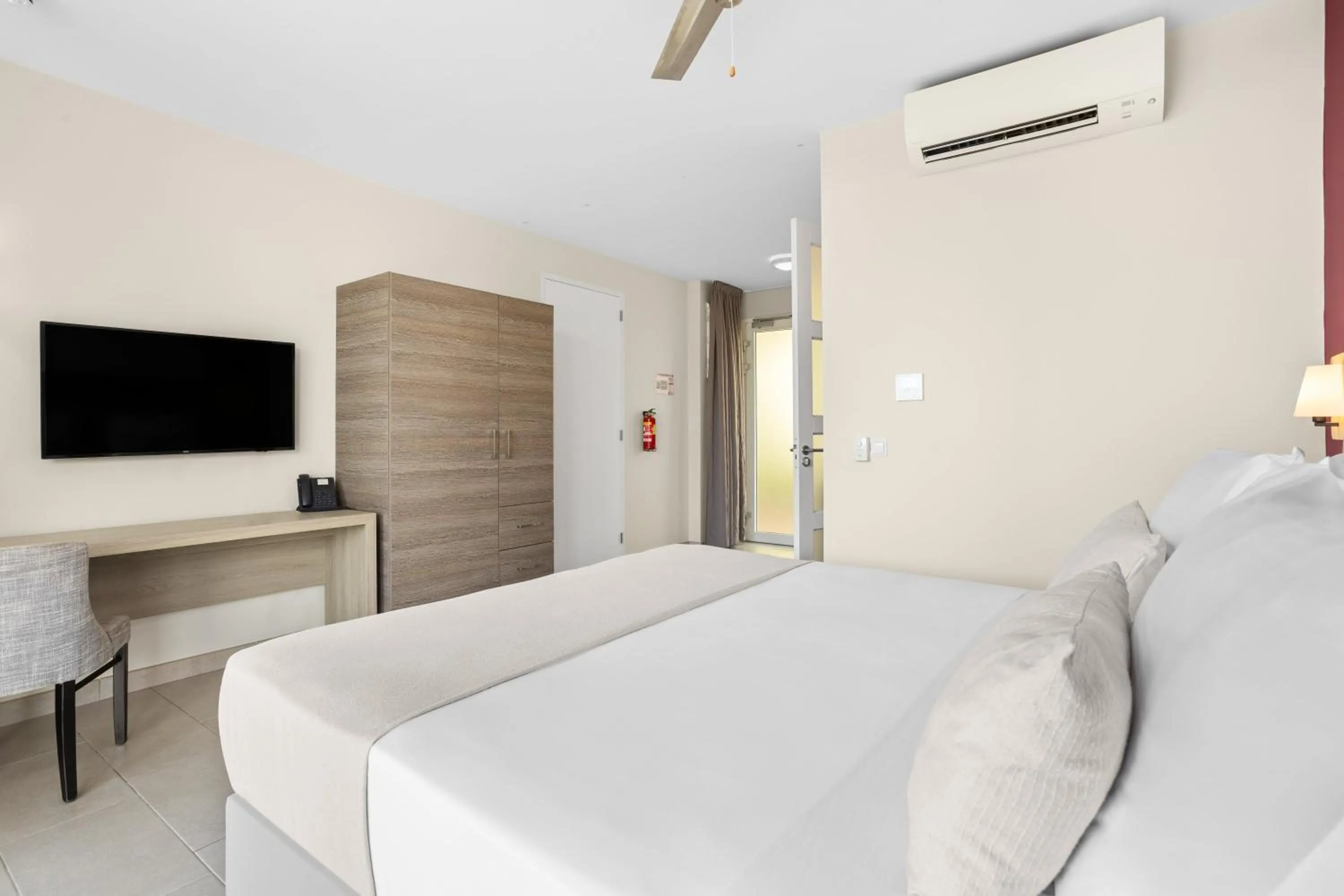 Bed in Delfins Beach Resort Bonaire, Tapestry Collection by Hilton