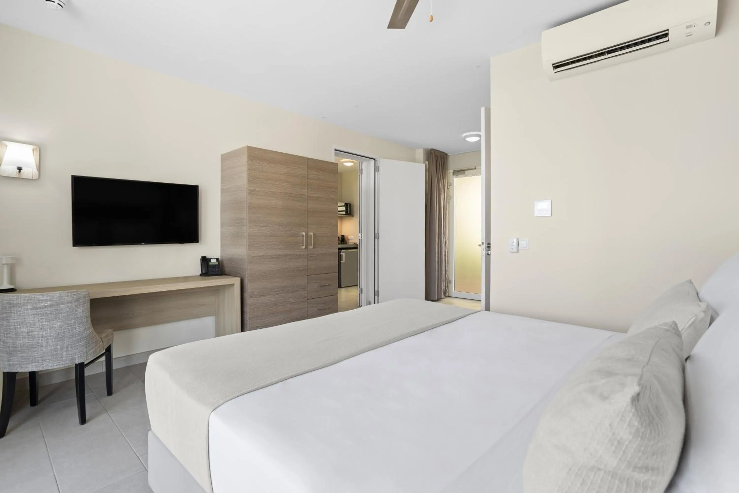 Bed in Delfins Beach Resort Bonaire, Tapestry Collection by Hilton