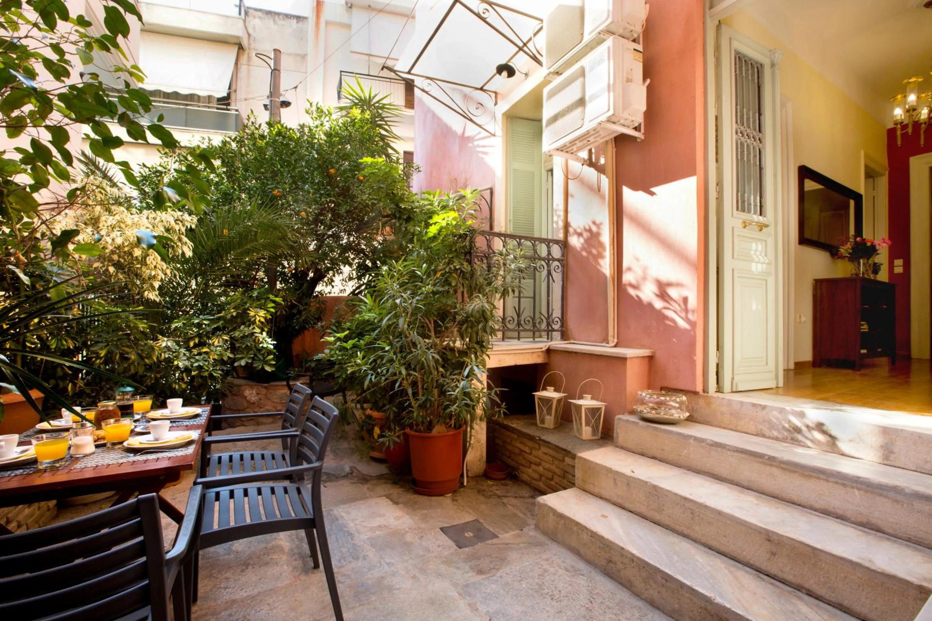 Patio in Acropolis Neoclassical Mansion by YHA