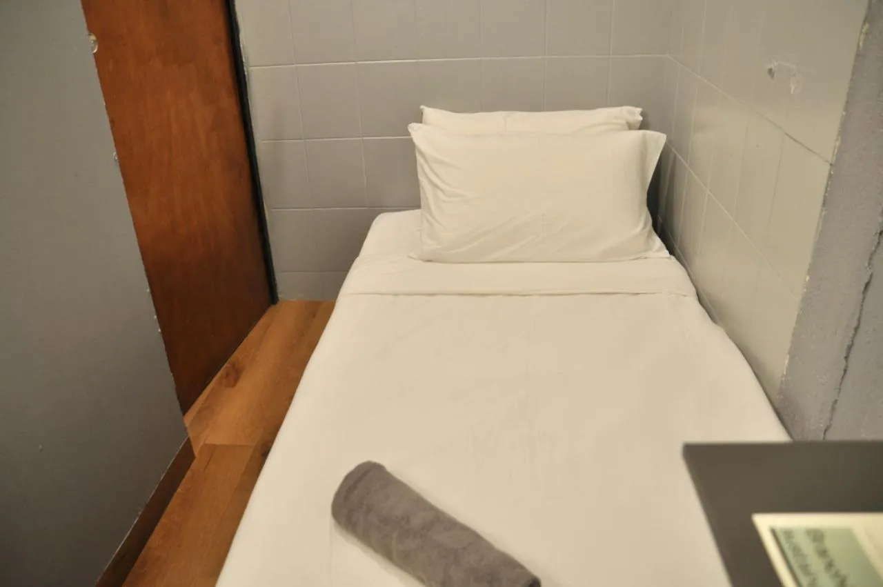 Bed in GRAYHAUS Guest House